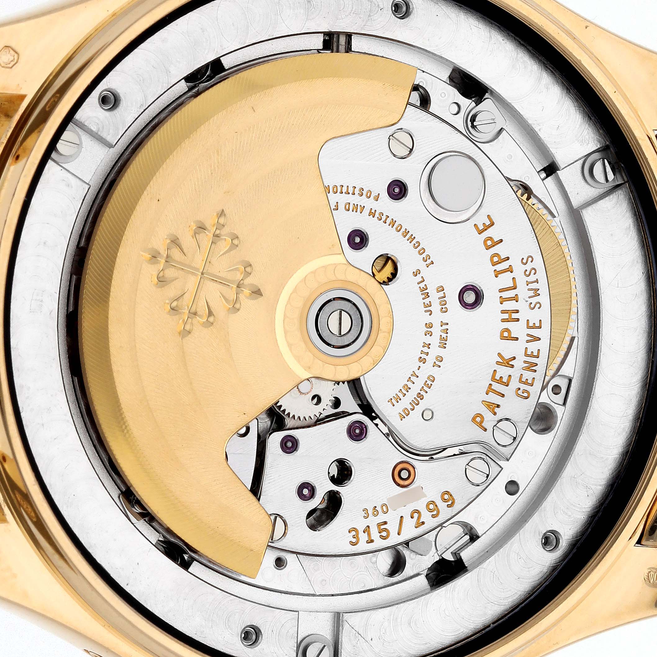 This image shows the back of a Patek Philippe Complications 5146J Men's Yellow Gold White Dial 5146J Men's Yellow Gold White Dial watch, highlighting the movement and intricate mechanical parts.
