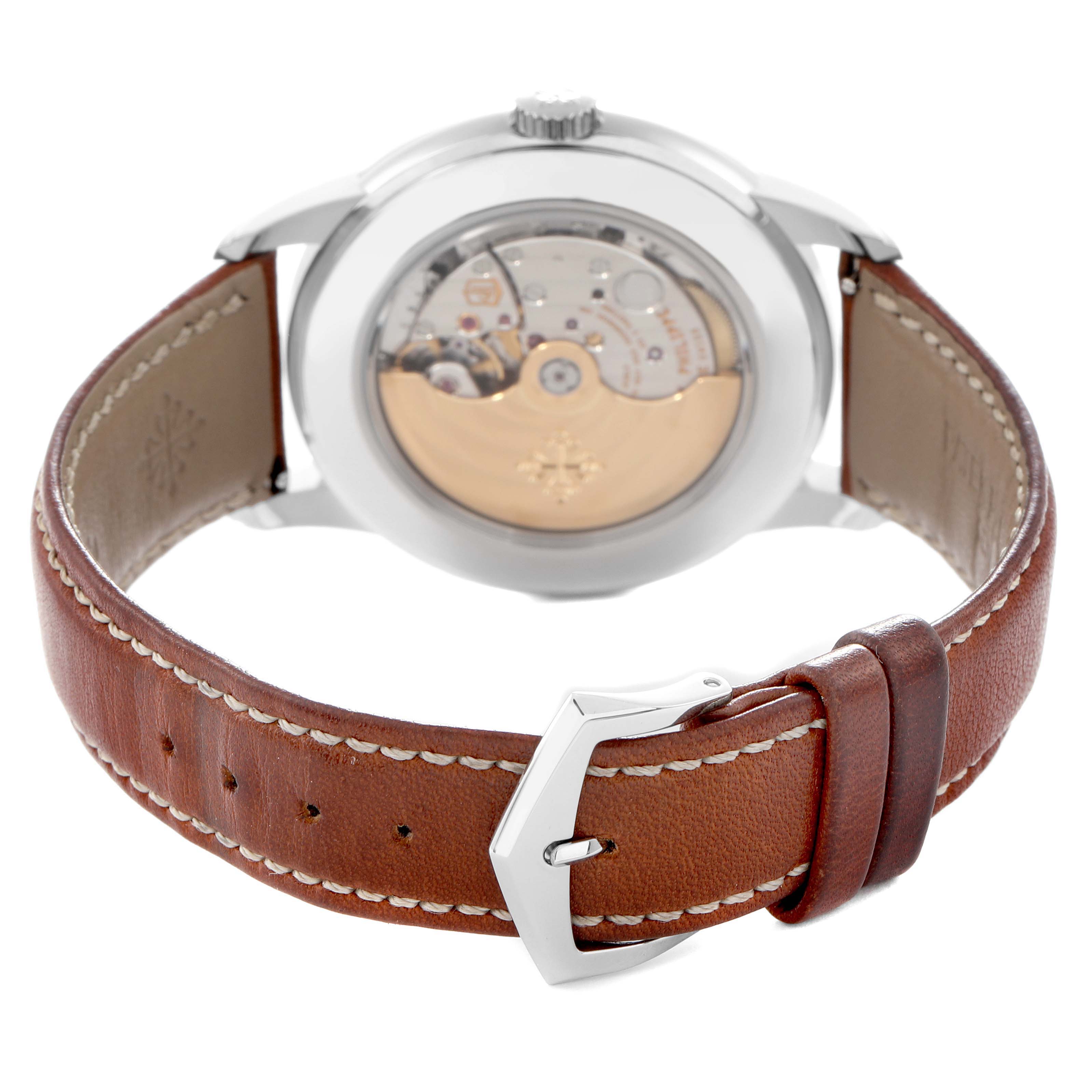 The image shows the back view of a Patek Philippe Complications 5212A-001 Men
s Stainless Steel Silver Dial 5212A-001 Men
s Stainless Steel Silver Dial watch, highlighting the movement and leather strap.