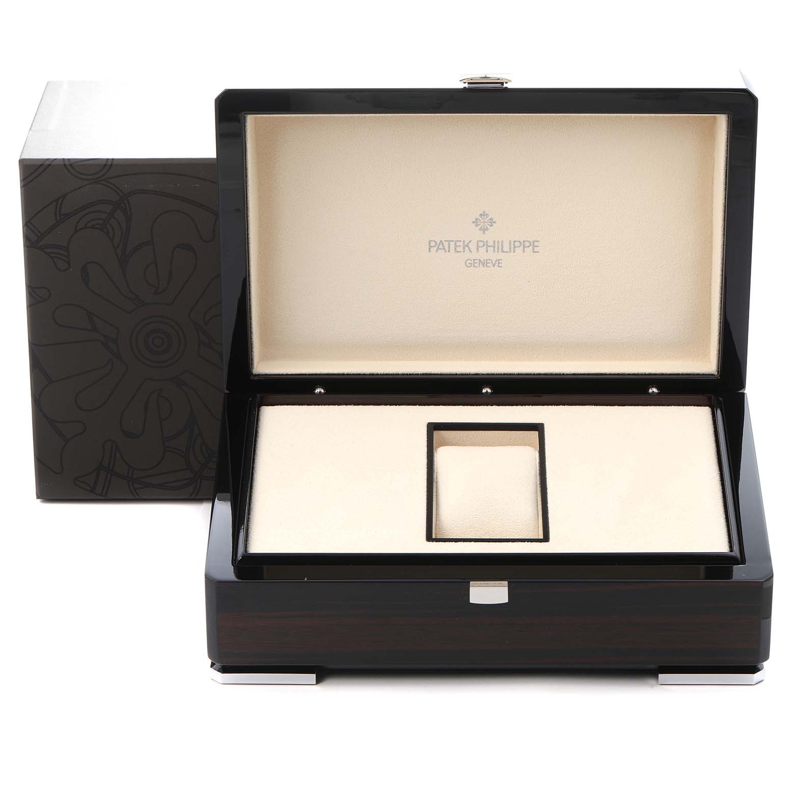 The image shows an open Patek Philippe Complications 5212A-001 Men
s Stainless Steel Silver Dial 5212A-001 Men
s Stainless Steel Silver Dial watch box, displaying its interior from a front angle.