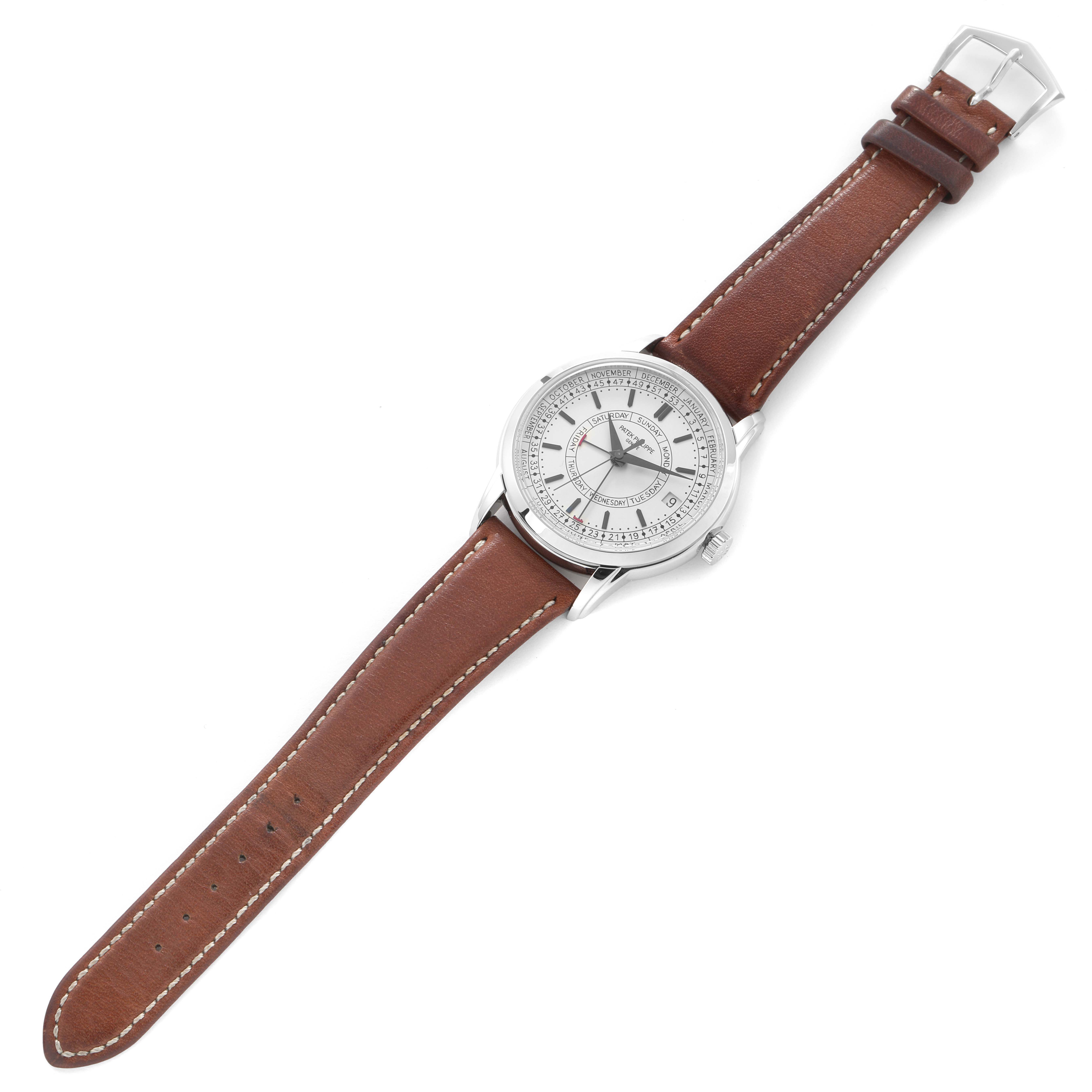 The Patek Philippe Complications 5212A-001 Men
s Stainless Steel Silver Dial 5212A-001 Men
s Stainless Steel Silver Dial watch is shown from a top-down angle, displaying the dial, case, and brown leather strap.