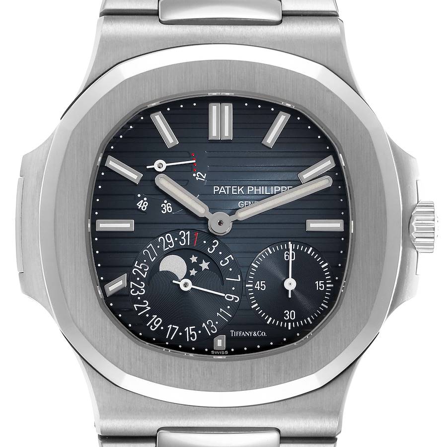The image shows a frontal view of the Patek Philippe Nautilus watch, highlighting the dial, subdials, and moon phase feature.