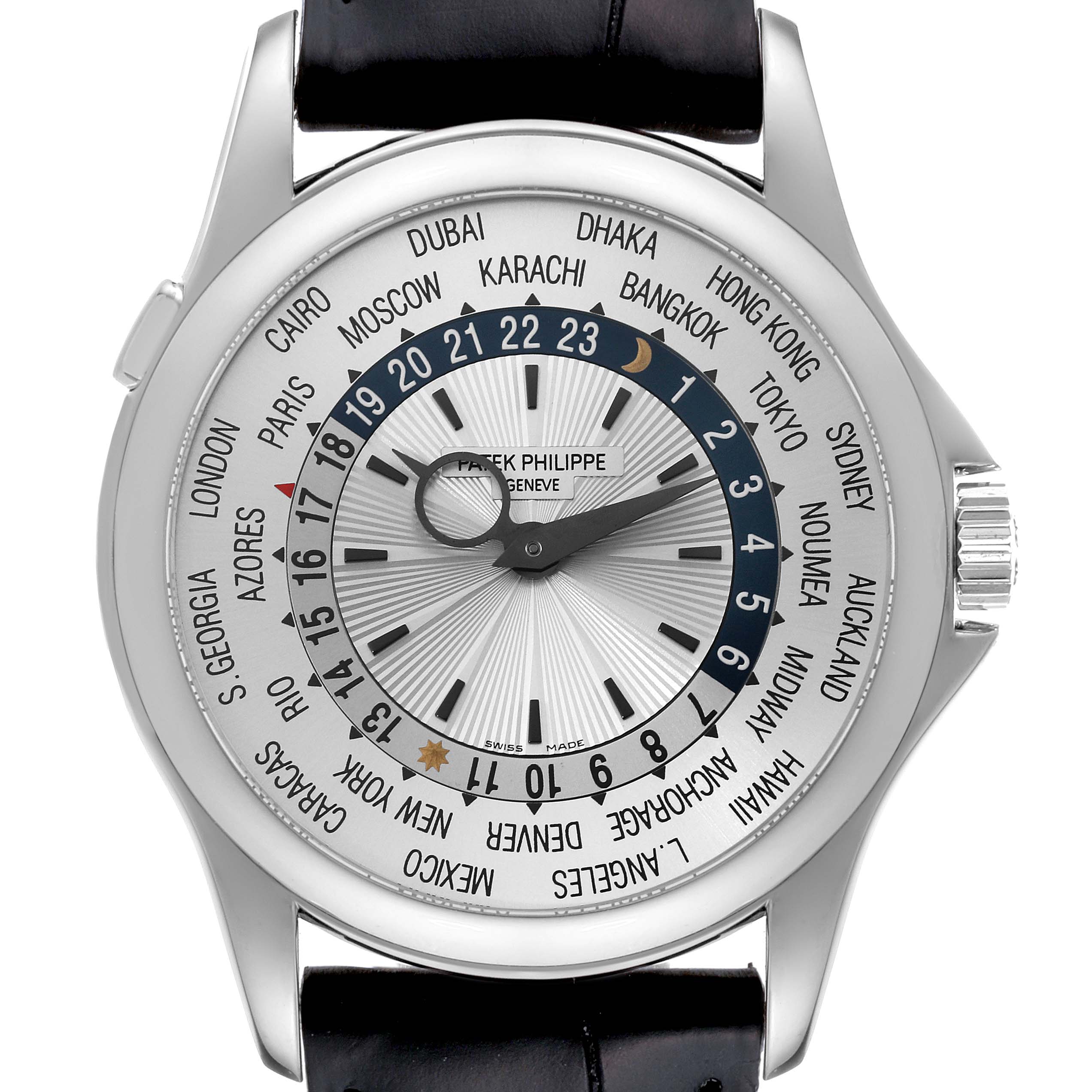 The image shows a frontal view of the Patek Philippe Complications 5130G Men
s White Gold Silver Dial 5130G Men
s White Gold Silver Dial model watch, highlighting its face and city time zones.
