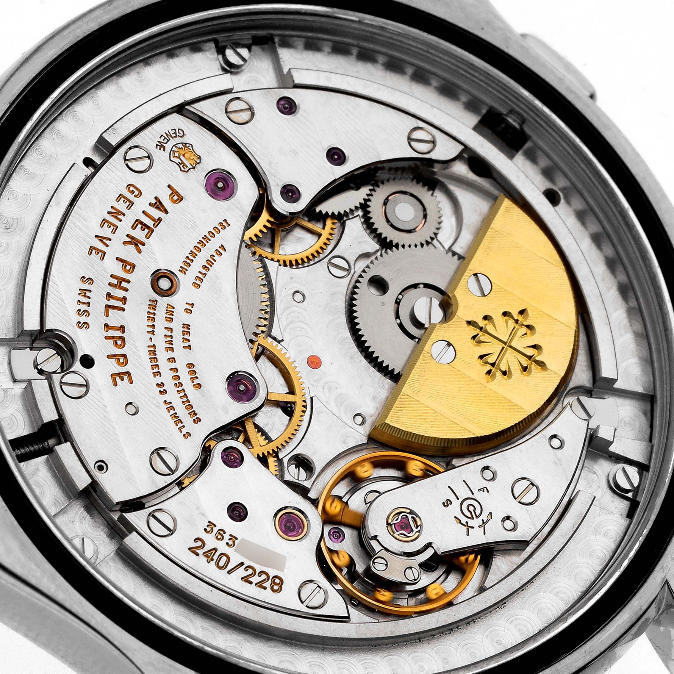 The image shows a detailed close-up of the movement of a Patek Philippe Complications 5130G Men
s White Gold Silver Dial 5130G Men
s White Gold Silver Dial model watch.