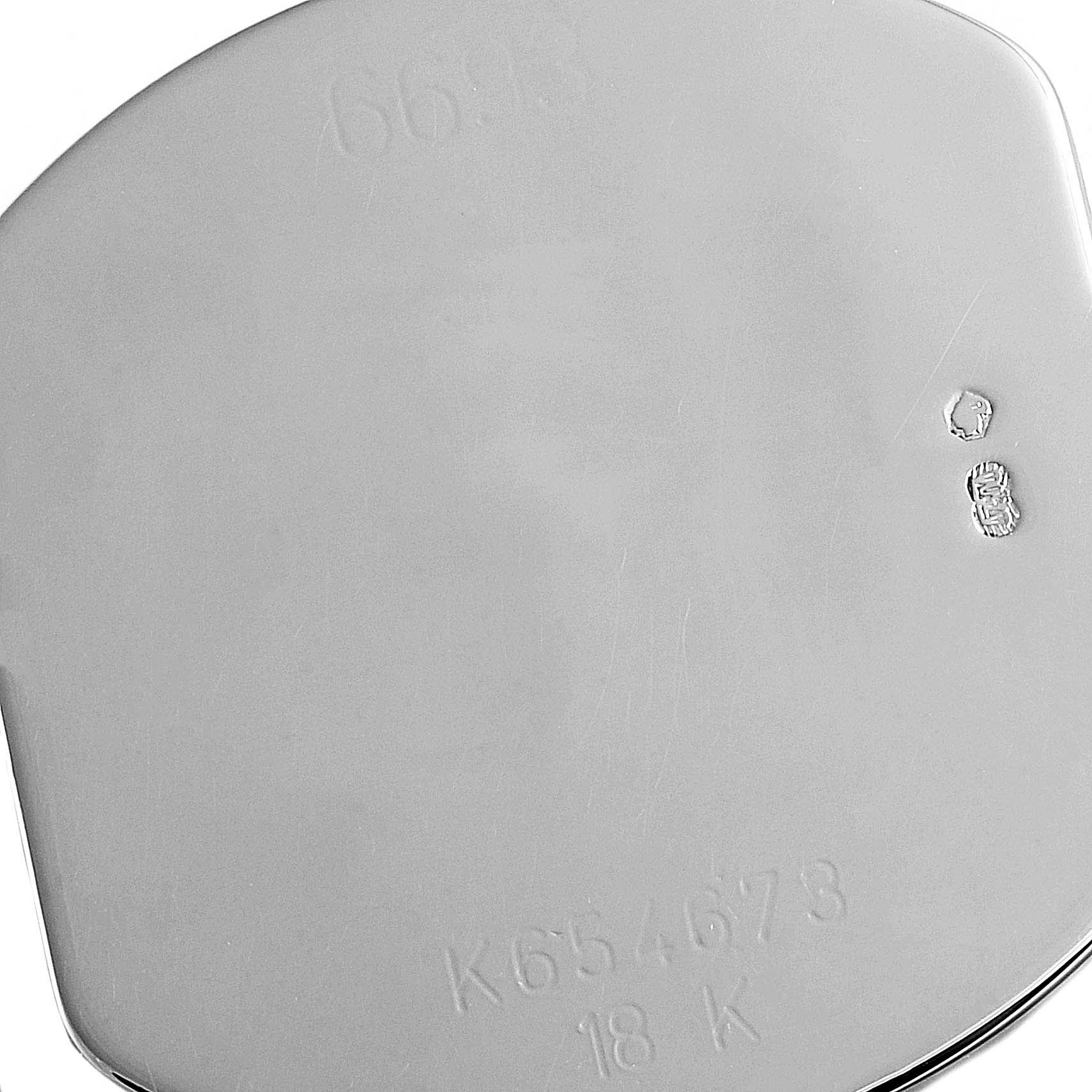 The image shows the back casing of a Rolex Cellini 6693 Women's White Gold Blue Dial 6693 Women's White Gold Blue Dial watch, highlighting its engraving and hallmarks.