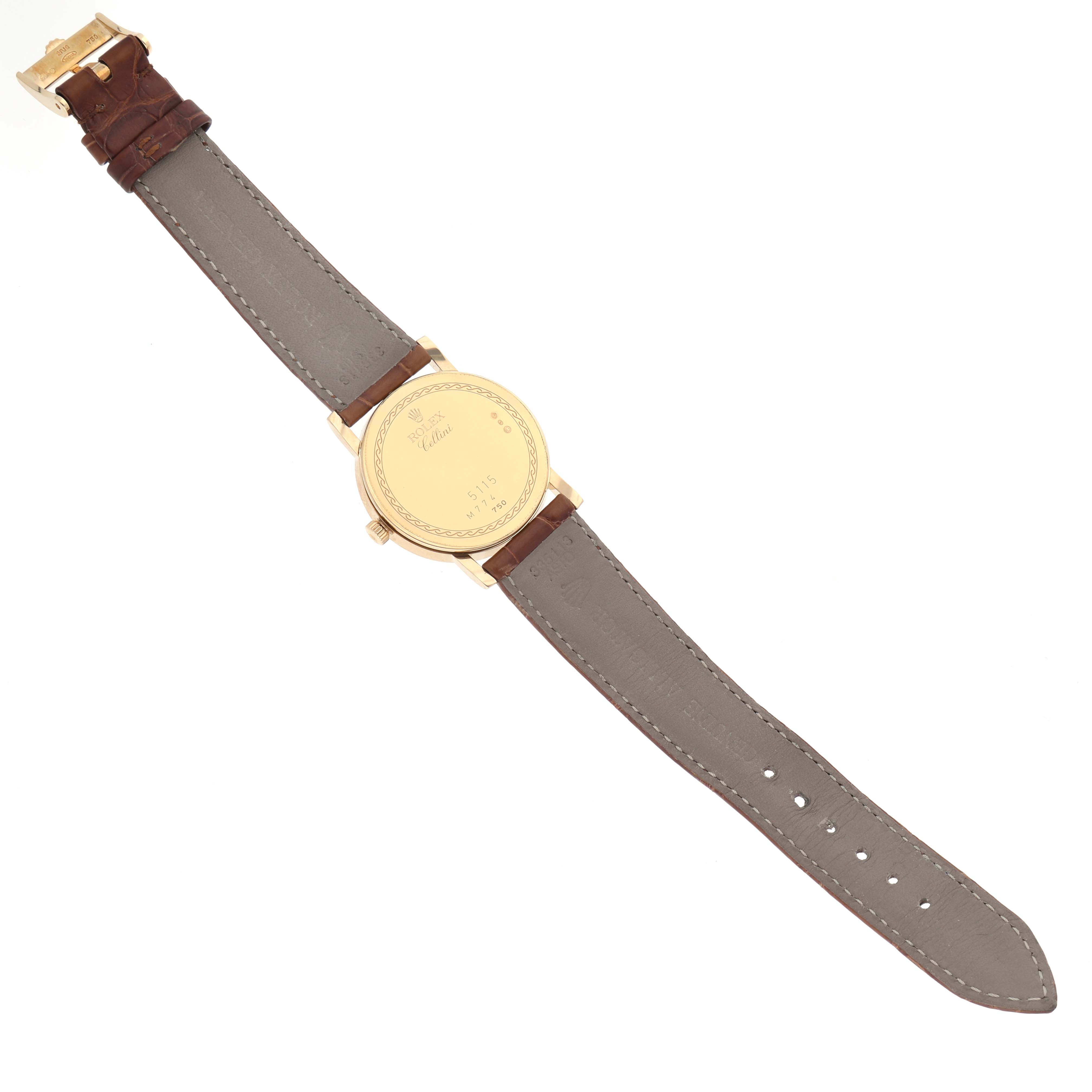The Rolex Cellini 5115 Men's Yellow Gold Champagne Dial 5115 Men's Yellow Gold Champagne Dial watch is shown from the back, highlighting the case and leather strap.