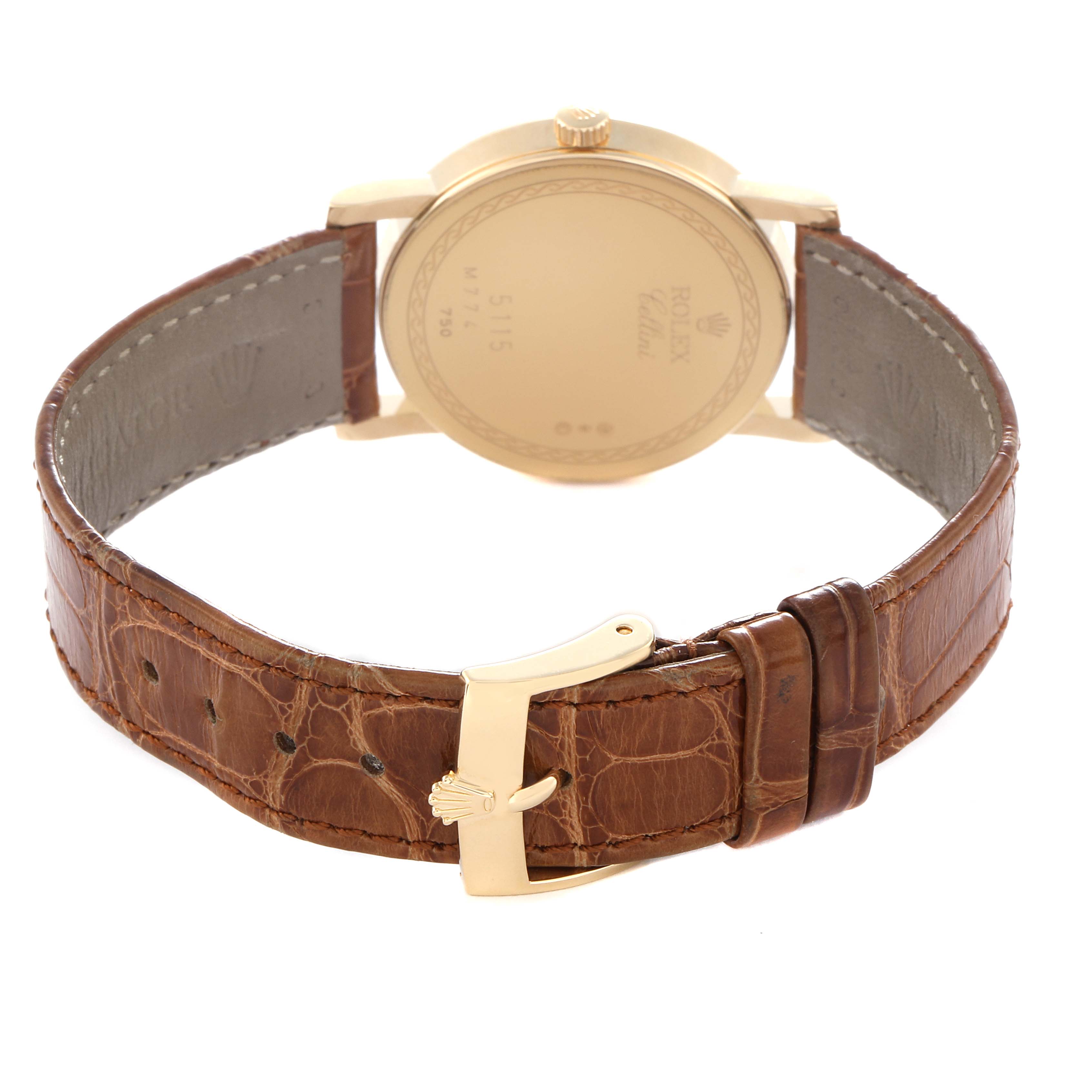 The image shows the back of a Rolex Cellini 5115 Men's Yellow Gold Champagne Dial 5115 Men's Yellow Gold Champagne Dial watch with a leather strap and gold clasp.