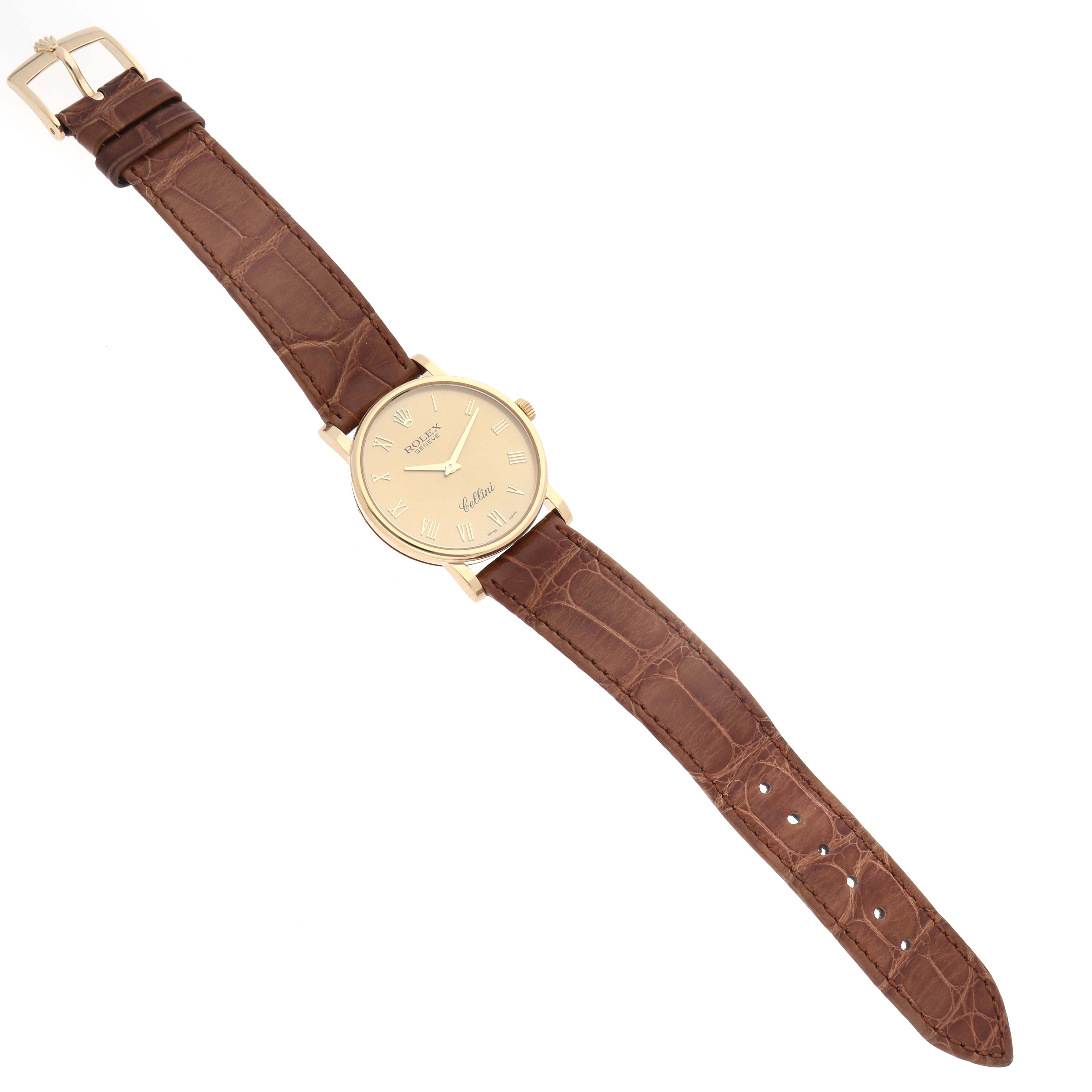 The Rolex Cellini 5115 Men's Yellow Gold Champagne Dial 5115 Men's Yellow Gold Champagne Dial watch is shown from a top view, highlighting its case, dial, and brown leather strap.