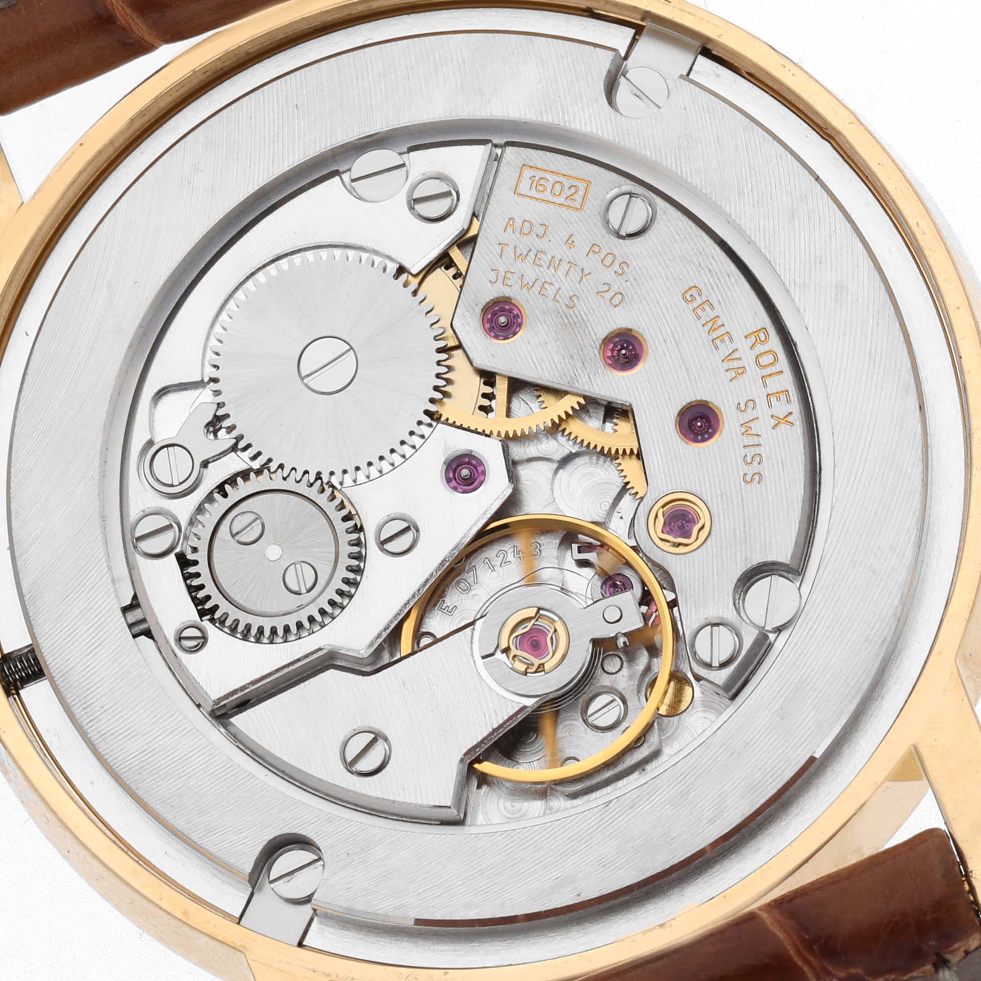 The image shows a close-up view of the Rolex Cellini 5115 Men's Yellow Gold Champagne Dial 5115 Men's Yellow Gold Champagne Dial's watch movement, highlighting gears and jewels from the back.