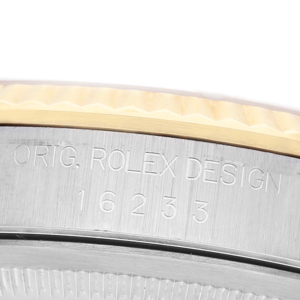 The image shows a close-up of the side of a Rolex Datejust 16233 Men's Steel and Gold (two tone) Champagne Dial, displaying the model number engraving.