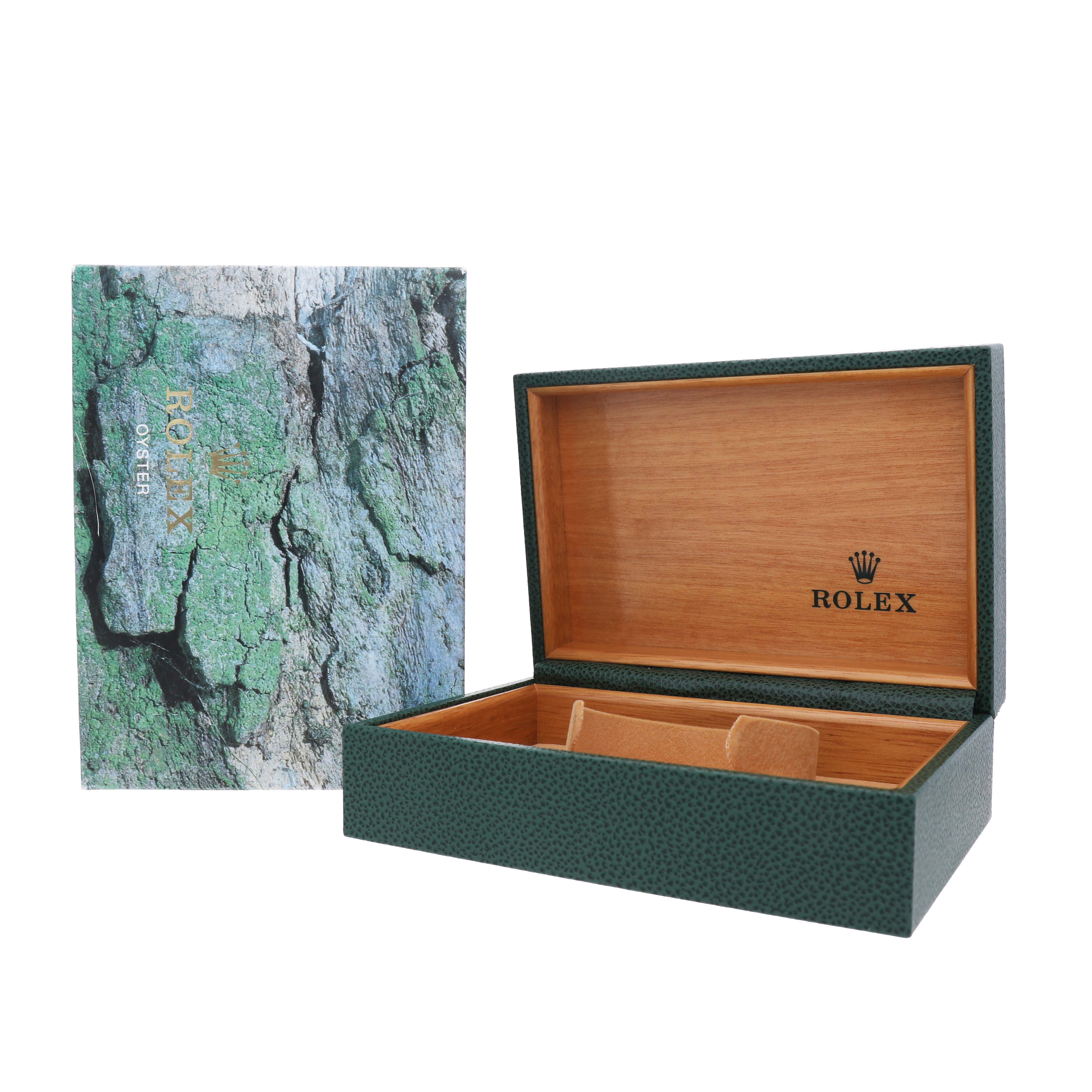 The image shows a green Rolex Datejust 16233 Men's Steel and Gold (two tone) Champagne Dial watch box and a textured outer box cover, both displayed open at an angle.
