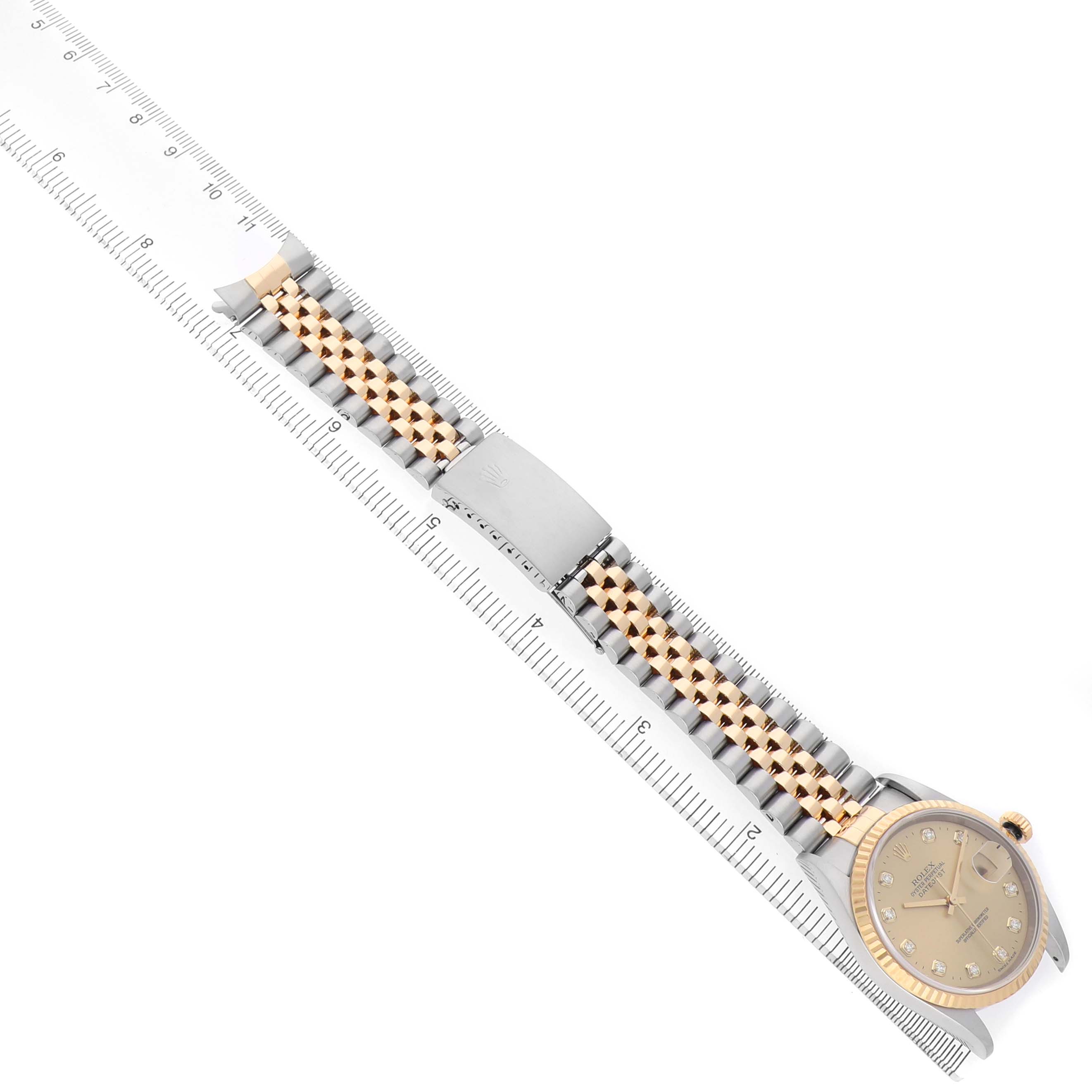 The Rolex Datejust 16233 Men's Steel and Gold (two tone) Champagne Dial watch is shown at a top-down angle, highlighting the bracelet, clasp, and part of the dial.