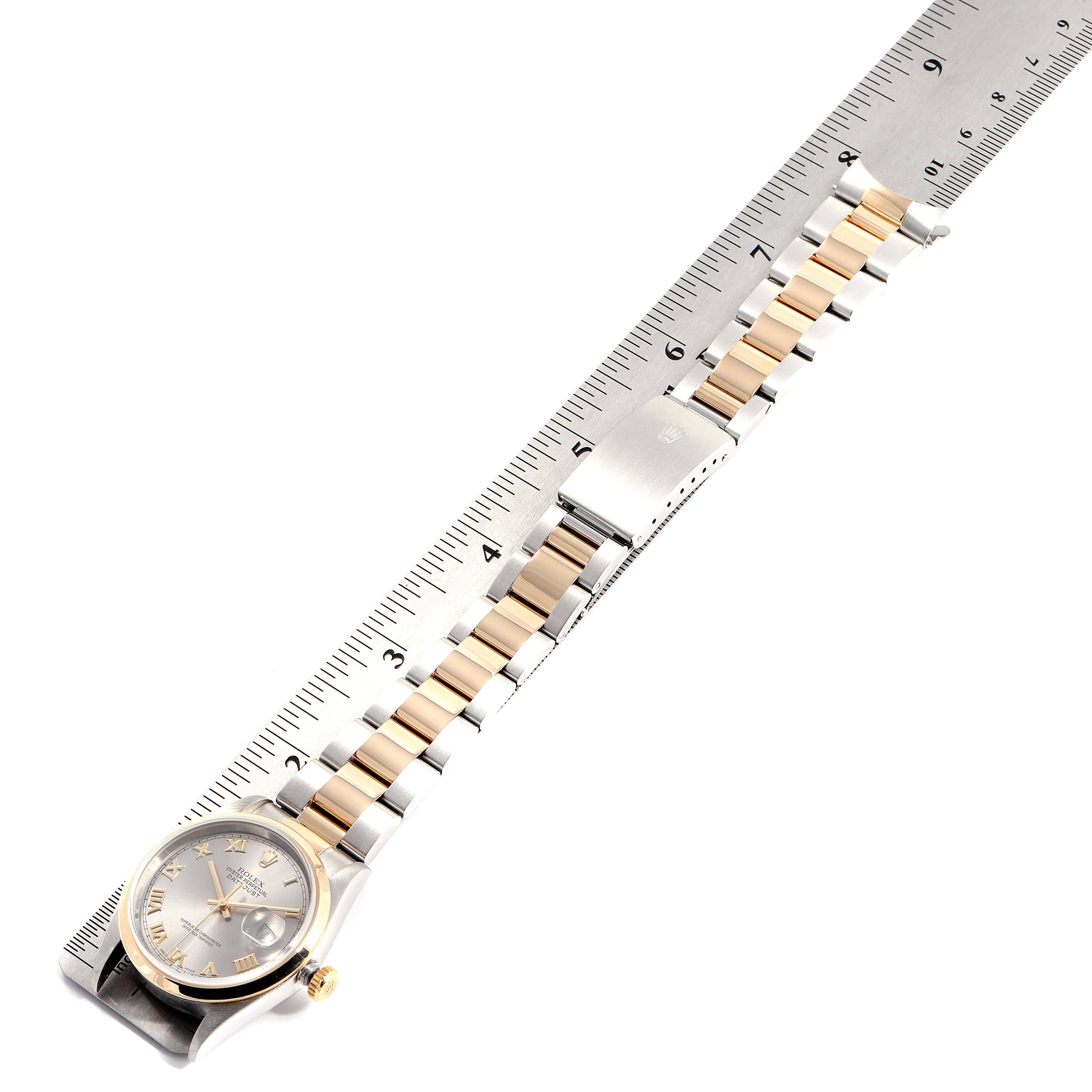 The image shows a Rolex Datejust 16203 Men
s Steel and Gold (two tone) Grey Dial 16203 Men
s Steel and Gold (two tone) Grey Dial watch laid flat with a ruler for measurement.