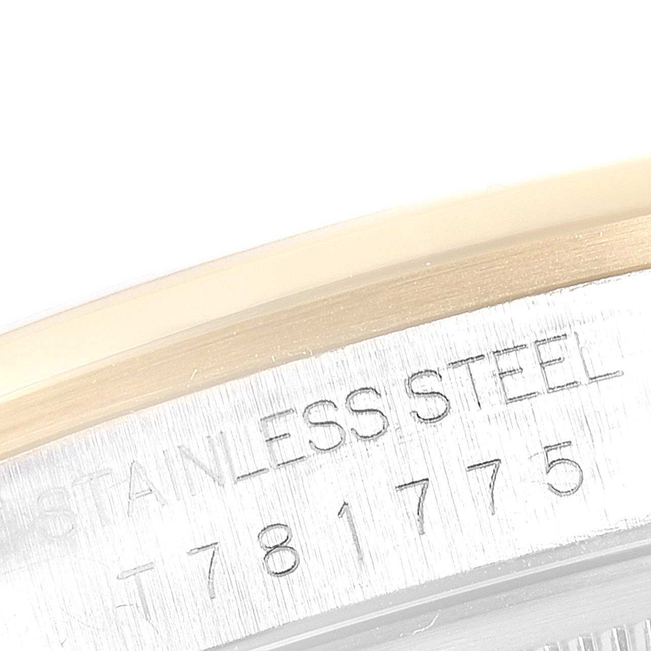 This image shows a close-up of the serial number engraving with "STAINLESS STEEL" on the case of a Rolex Datejust 16203 Men
s Steel and Gold (two tone) Grey Dial 16203 Men
s Steel and Gold (two tone) Grey Dial watch.
