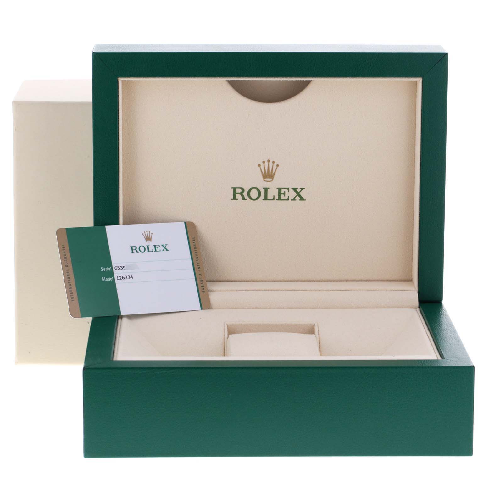 The image shows an open green and beige Rolex box with a warranty card for the Rolex Datejust 41 126334 Men
s Stainless Steel Grey Dial 126334 Men
s Stainless Steel Grey Dial model 126334.