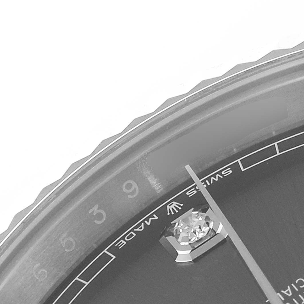 The image shows a close-up of the dial and bezel of a Rolex Datejust 41 126334 Men
s Stainless Steel Grey Dial 126334 Men
s Stainless Steel Grey Dial watch, focusing on the "Swiss Made" text and minute markers.