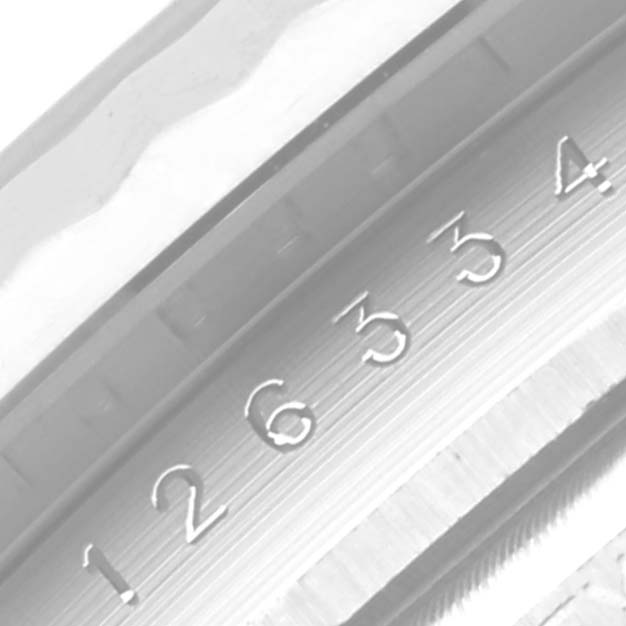 A close-up angle showing a portion of the bezel and the engraved numbers on the inner rim of the Rolex Datejust 41 126334 Men's Stainless Steel Mother of Pearl Dial 126334 Men's Stainless Steel Mother of Pearl Dial model.