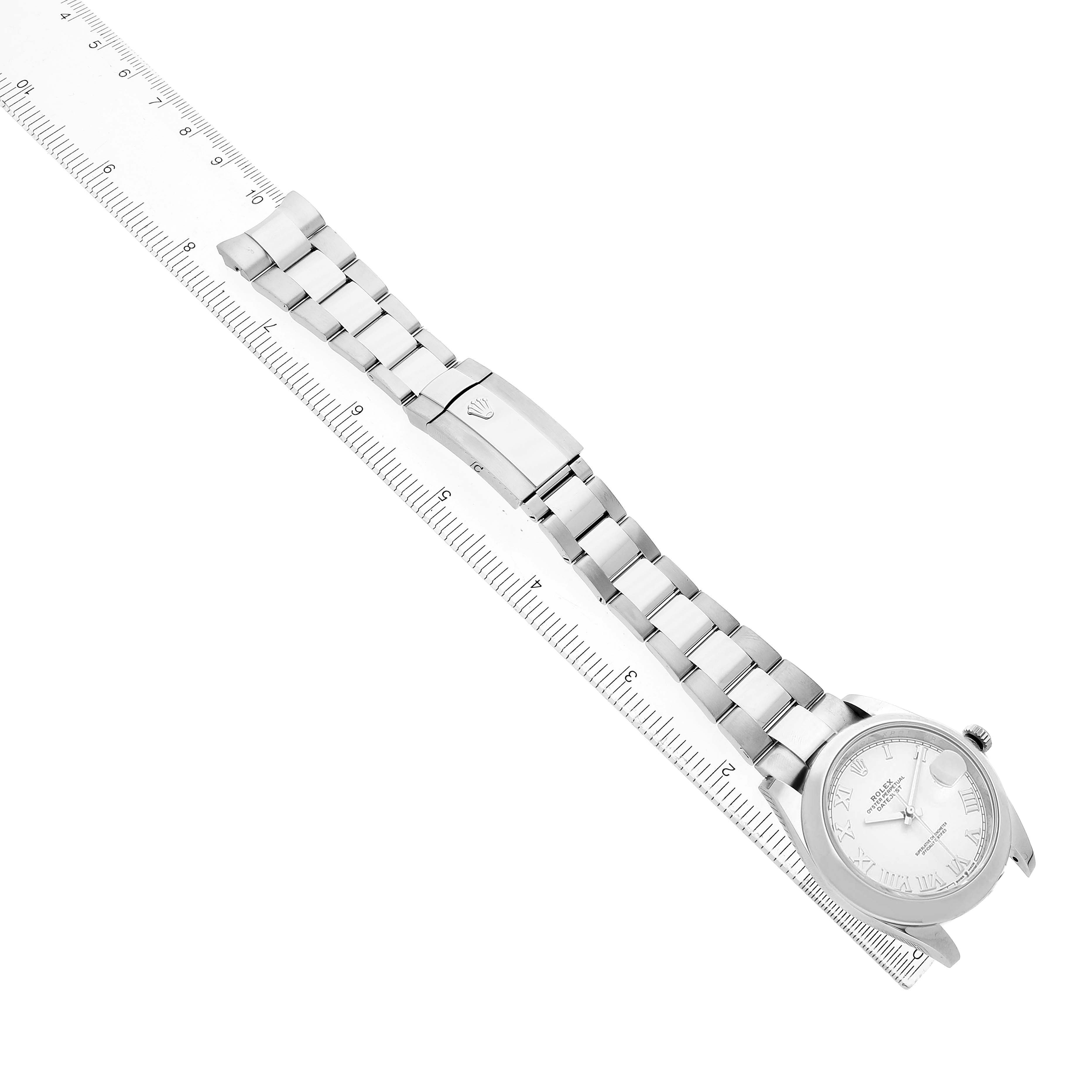 The Rolex Datejust 41 126300 Men's Stainless Steel White Dial watch is positioned diagonally, showing the face, case, and bracelet alongside a ruler for scale.