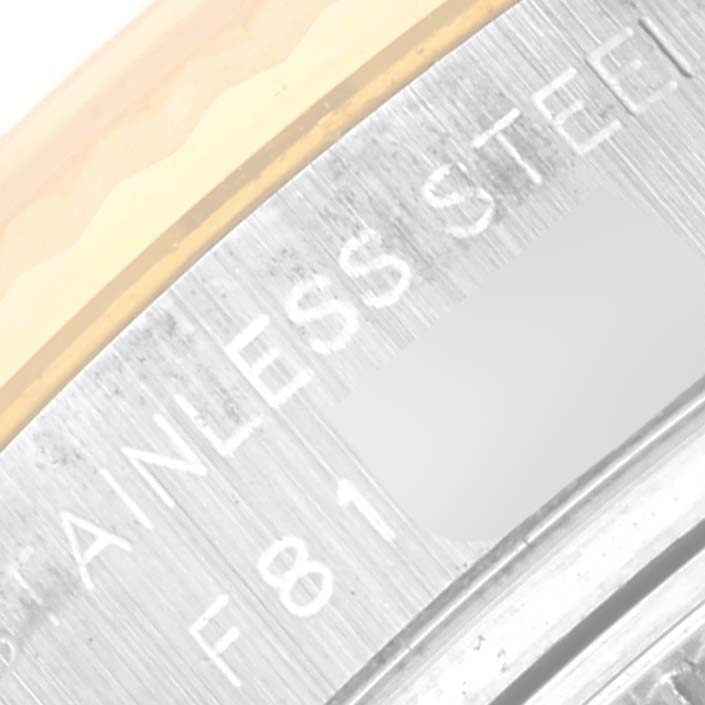 The image shows a close-up of the side of a Rolex Datejust 179173 Women's Steel and Gold (two tone) Champagne Dial 179173 Women's Steel and Gold (two tone) Champagne Dial watch, focusing on the stainless steel part of the case.