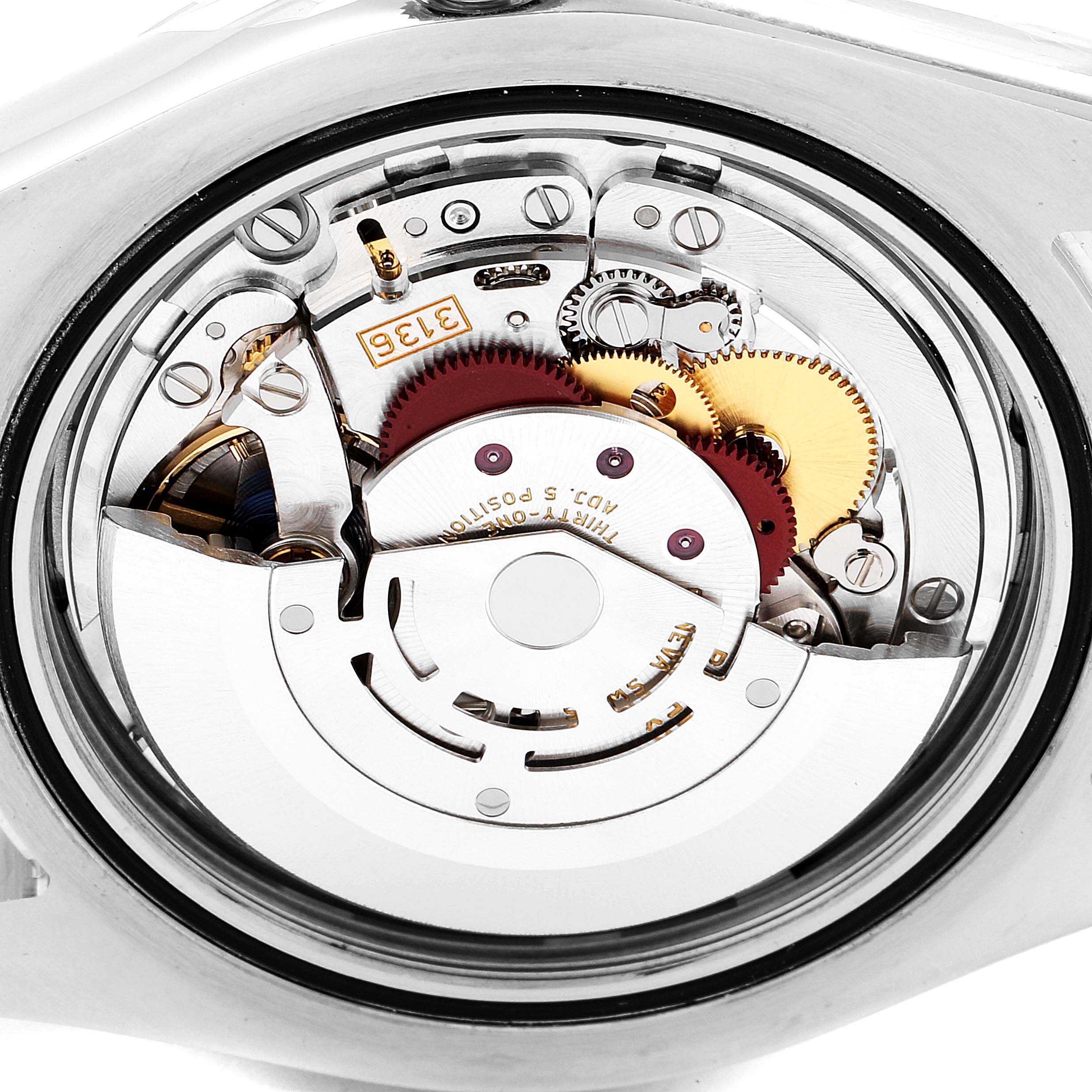 This is a close-up view of the movement mechanism inside a Rolex Datejust 41 116334 Men
s Stainless Steel Blue Dial 116334 Men
s Stainless Steel Blue Dial watch.