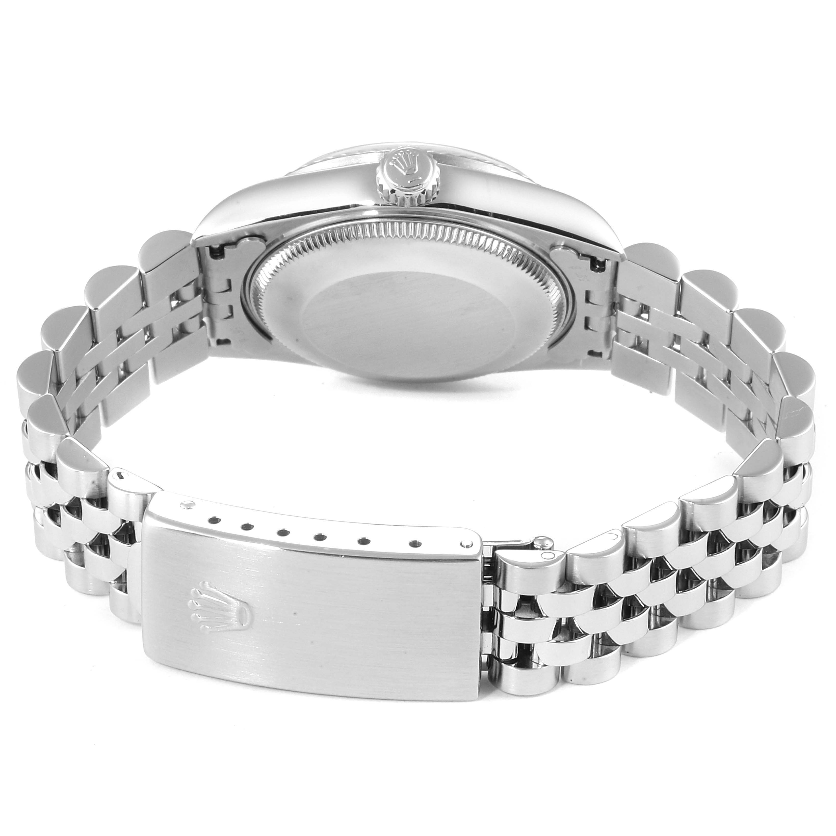 This image shows the Rolex Mid-Size 28322 Women
s Stainless Steel Blue Dial 28322 Women
s Stainless Steel Blue Dial model watch from a rear angle, displaying its case back, crown, and bracelet with the clasp.