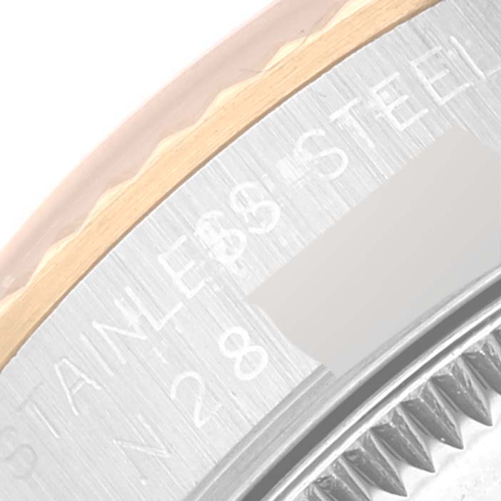 This image showcases a close-up of the bezel and case of a Rolex Mid-Size 68273 Women
s Steel and Gold (two tone) Black Dial 68273 Women
s Steel and Gold (two tone) Black Dial watch.