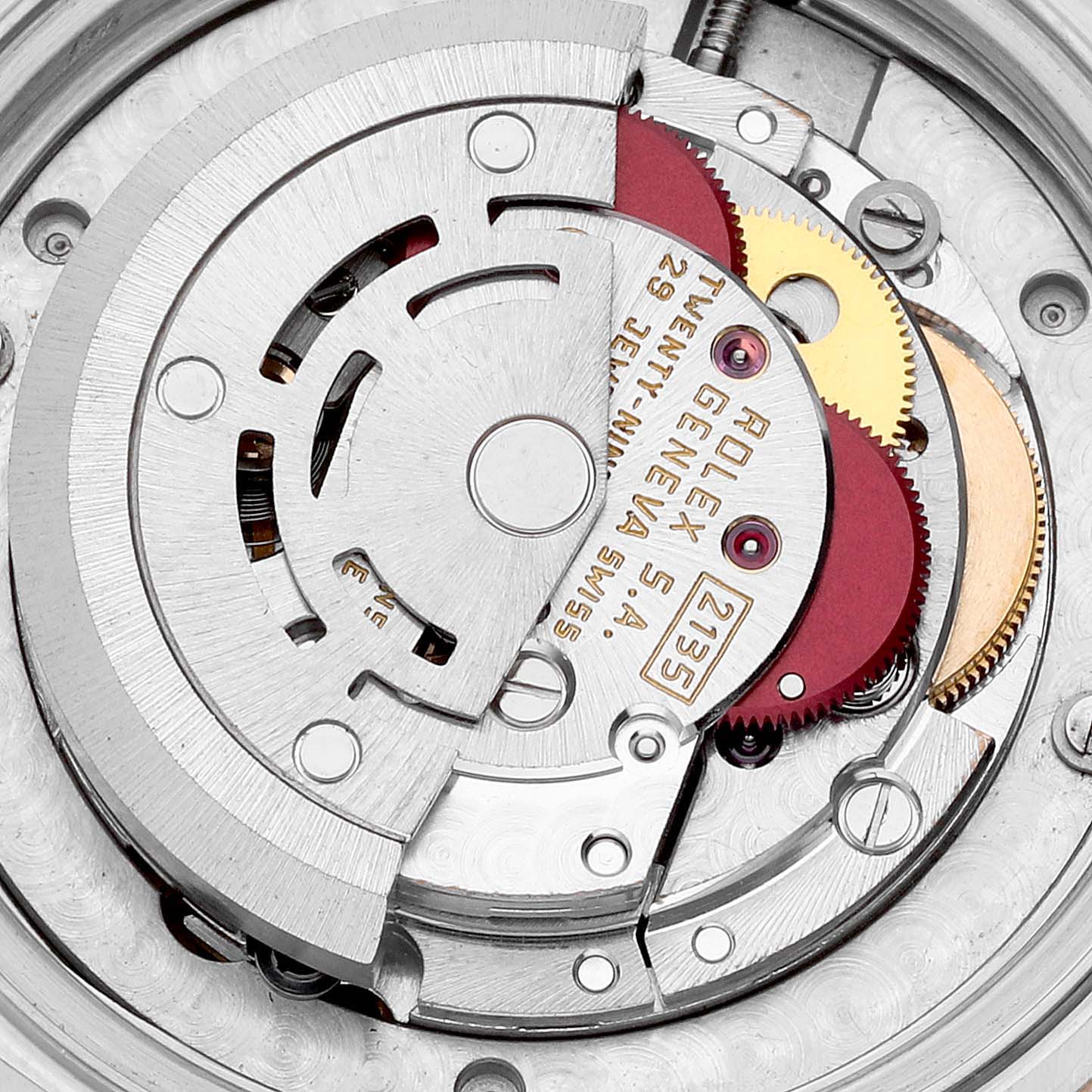 This image shows a close-up view of the internal movement parts of a Mid-Size Rolex watch.