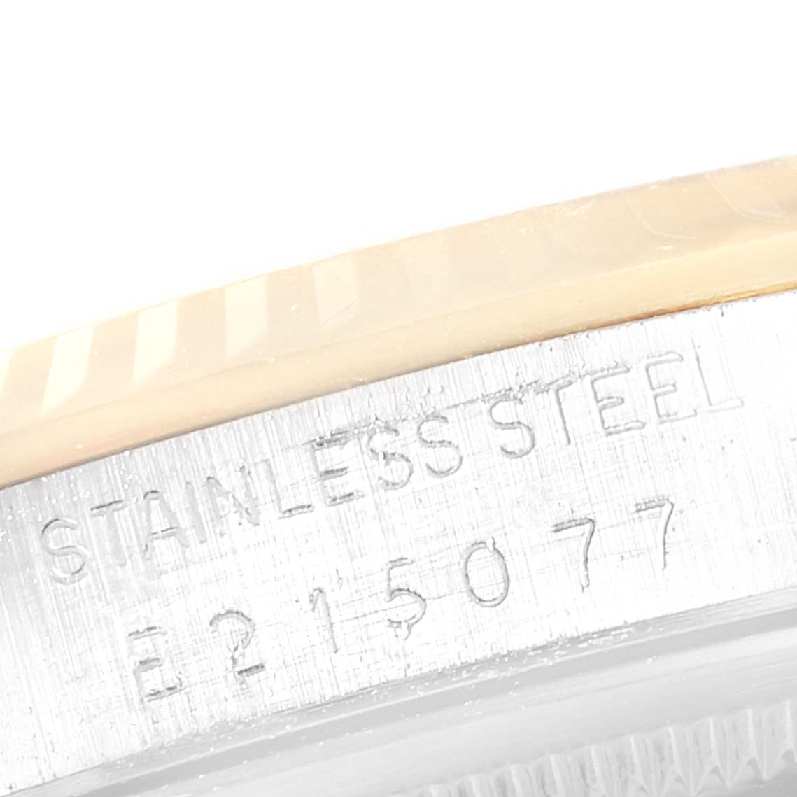 This close-up photo shows the stainless steel case with the engraved serial number of the Rolex Datejust 16233 Men
s Steel and Gold (two tone) Champagne Dial 16233 Men
s Steel and Gold (two tone) Champagne Dial watch.