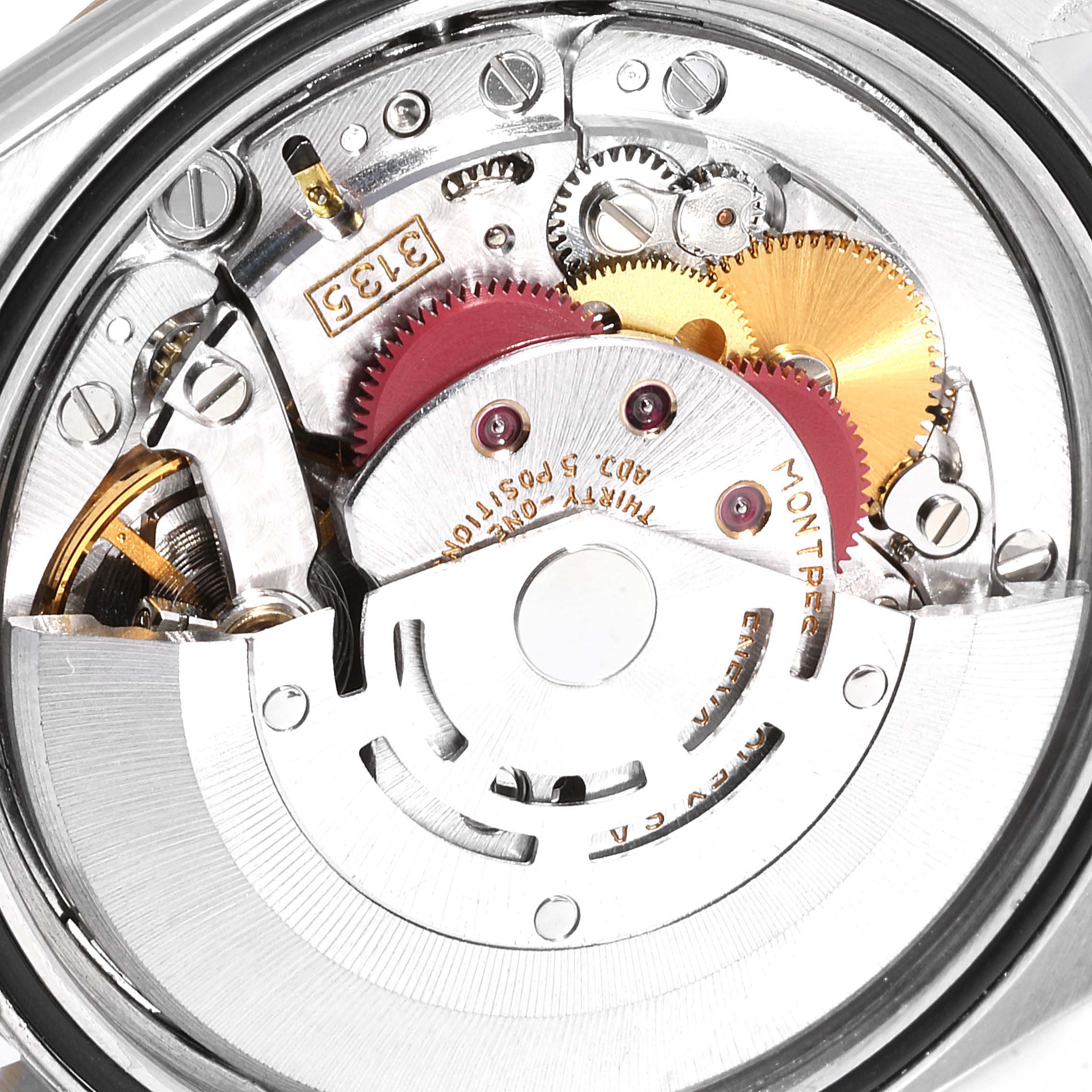 This image shows a close-up view of the inner mechanical components of a Rolex Datejust 16233 Men
s Steel and Gold (two tone) Champagne Dial 16233 Men
s Steel and Gold (two tone) Champagne Dial watch.