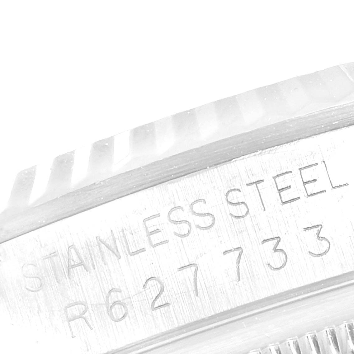 This image shows a close-up of the case side of a Rolex Datejust 16234 Men's Steel and Gold (two tone) Blue Dial 16234 Men's Steel and Gold (two tone) Blue Dial, featuring its stainless steel marking.