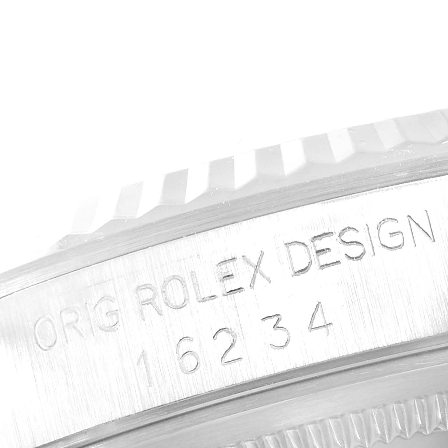 The image shows a close-up of the case side and bezel of a Rolex Datejust 16234 Men's Steel and Gold (two tone) Blue Dial 16234 Men's Steel and Gold (two tone) Blue Dial model, revealing the engraved reference number.
