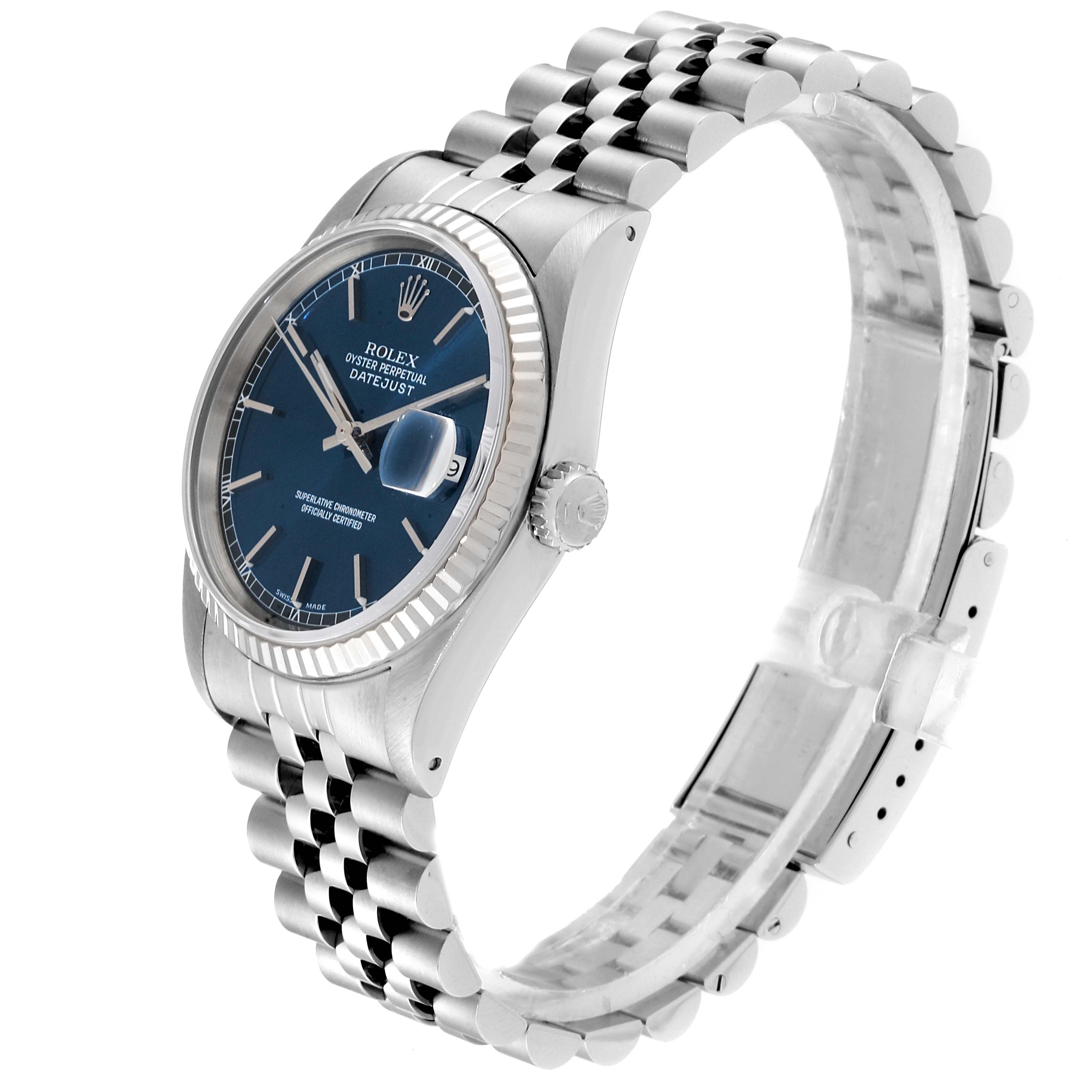 The image shows a Rolex Datejust 16234 Men's Steel and Gold (two tone) Blue Dial 16234 Men's Steel and Gold (two tone) Blue Dial watch from a side angle, highlighting its blue dial, fluted bezel, and jubilee bracelet.