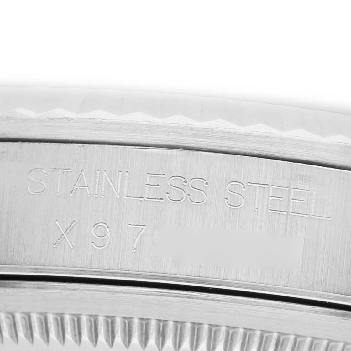 The image shows a close-up of the stainless steel engraving on the side of a Rolex Datejust 16234 Men's Stainless Steel Silver Dial watch.
