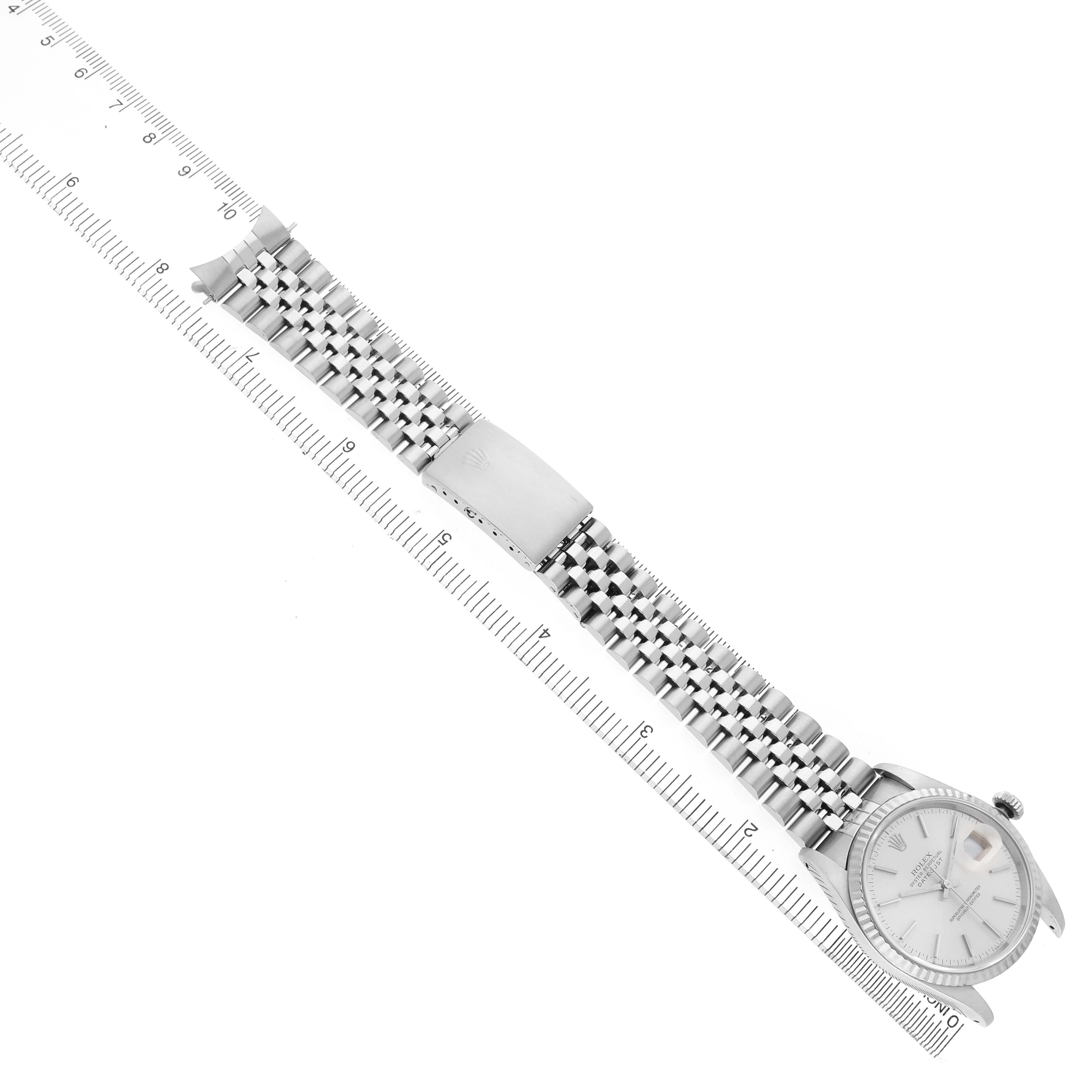 The Rolex Datejust 16234 Men's Stainless Steel Silver Dial watch is shown from a top-down angle, displaying the face, bezel, and part of the bracelet.