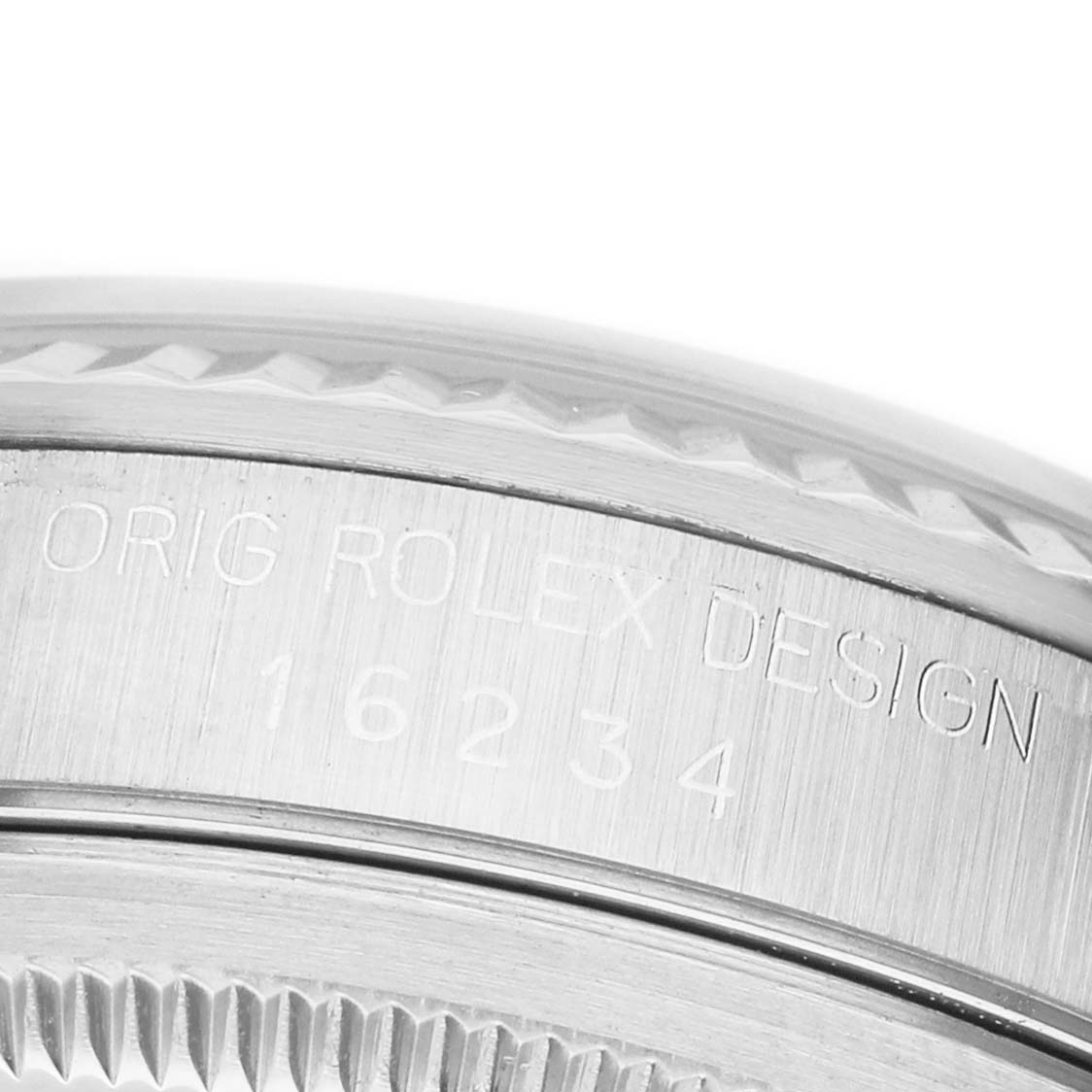 This image shows a close-up of the side of the Rolex Datejust 16234 Men's Stainless Steel Silver Dial watch case, highlighting the engraved model number.