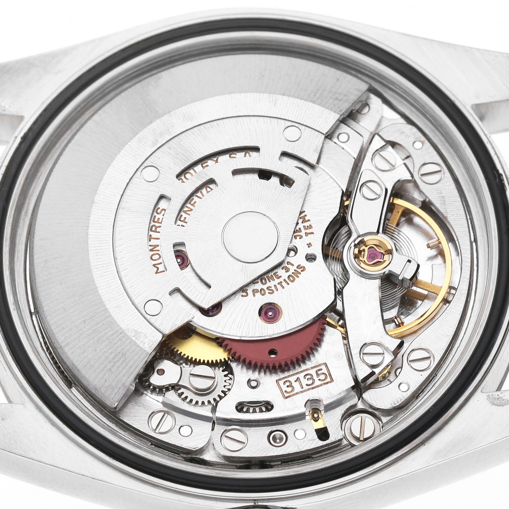 The image shows the movement of a Rolex Datejust 16234 Men's Stainless Steel Silver Dial watch from a top-down angle, highlighting its intricate internal mechanics.