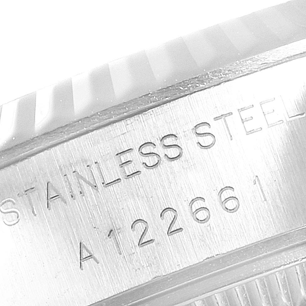 The image shows a close-up angle of the case side engraving for a Rolex Datejust 69174 Women
s Stainless Steel Silver Dial 69174 Women
s Stainless Steel Silver Dial model, displaying "STAINLESS STEEL" and a serial number.