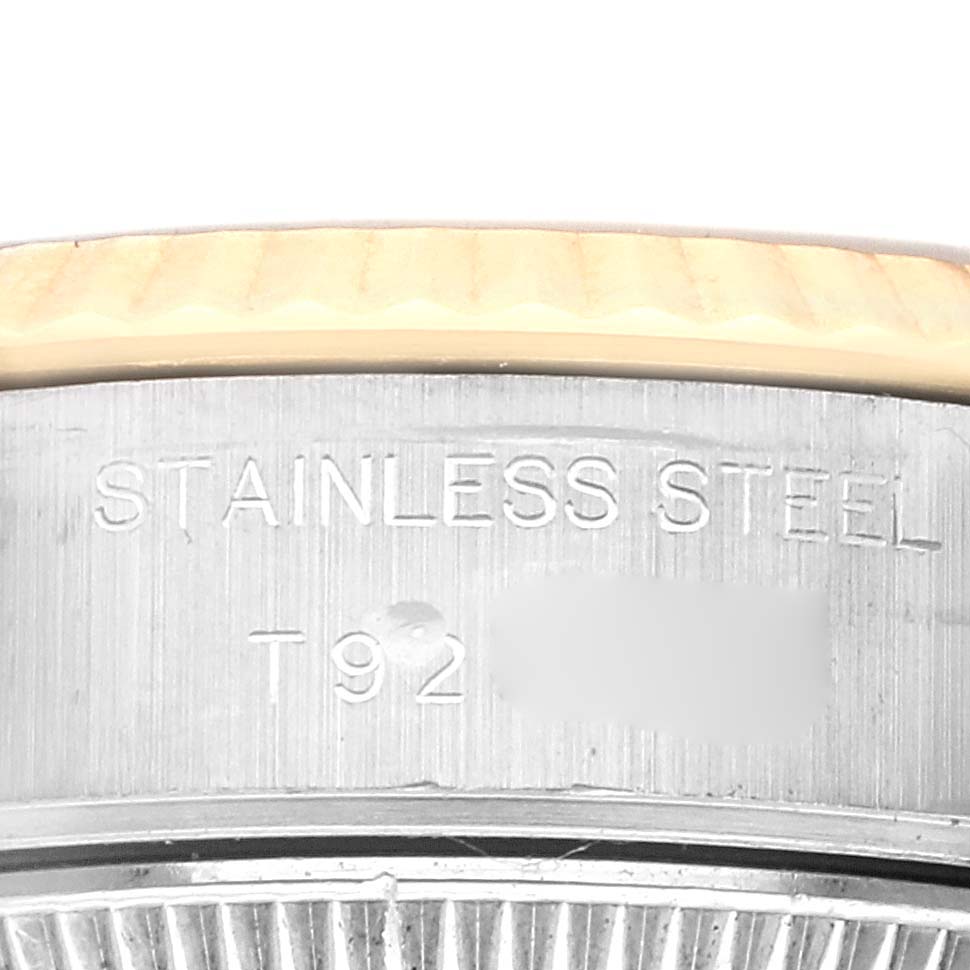 The image shows a close-up of the stainless steel side case and bezel of a Rolex Datejust 69173 Women
s Steel and Gold (two tone) Black Dial 69173 Women
s Steel and Gold (two tone) Black Dial watch, highlighting the engraving.