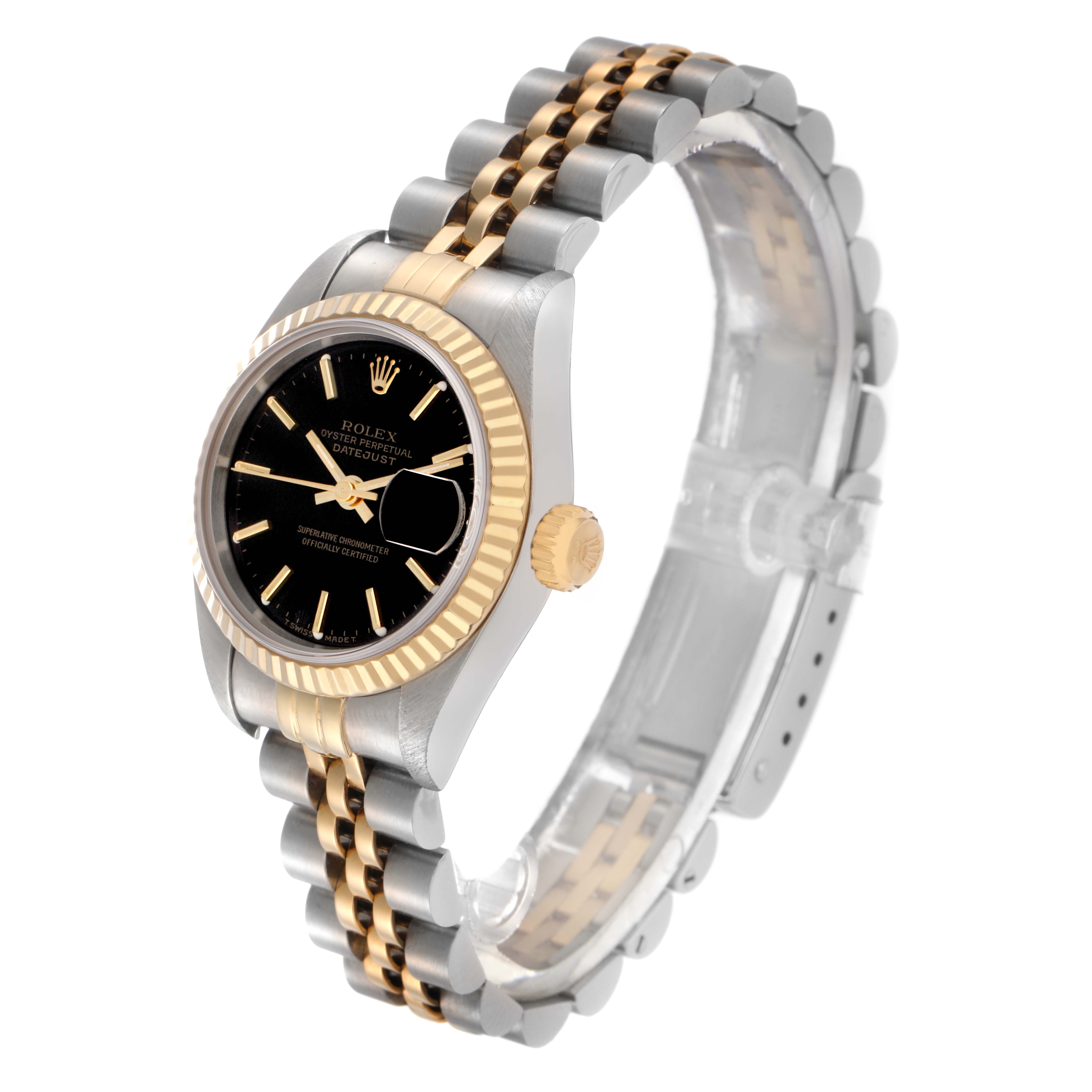 The Rolex Datejust 69173 Women
s Steel and Gold (two tone) Black Dial 69173 Women
s Steel and Gold (two tone) Black Dial watch is shown at an angled side view, highlighting its two-tone bracelet, fluted bezel, and black dial.