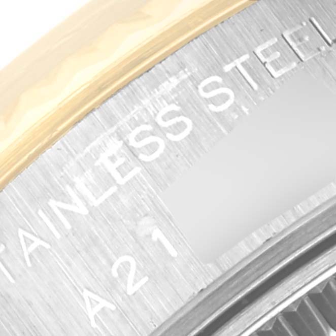 This close-up image shows the engraved text on the stainless steel case back of the Rolex Datejust 79173 Women's Steel and Gold (two tone) Black Dial 79173 Women's Steel and Gold (two tone) Black Dial watch.
