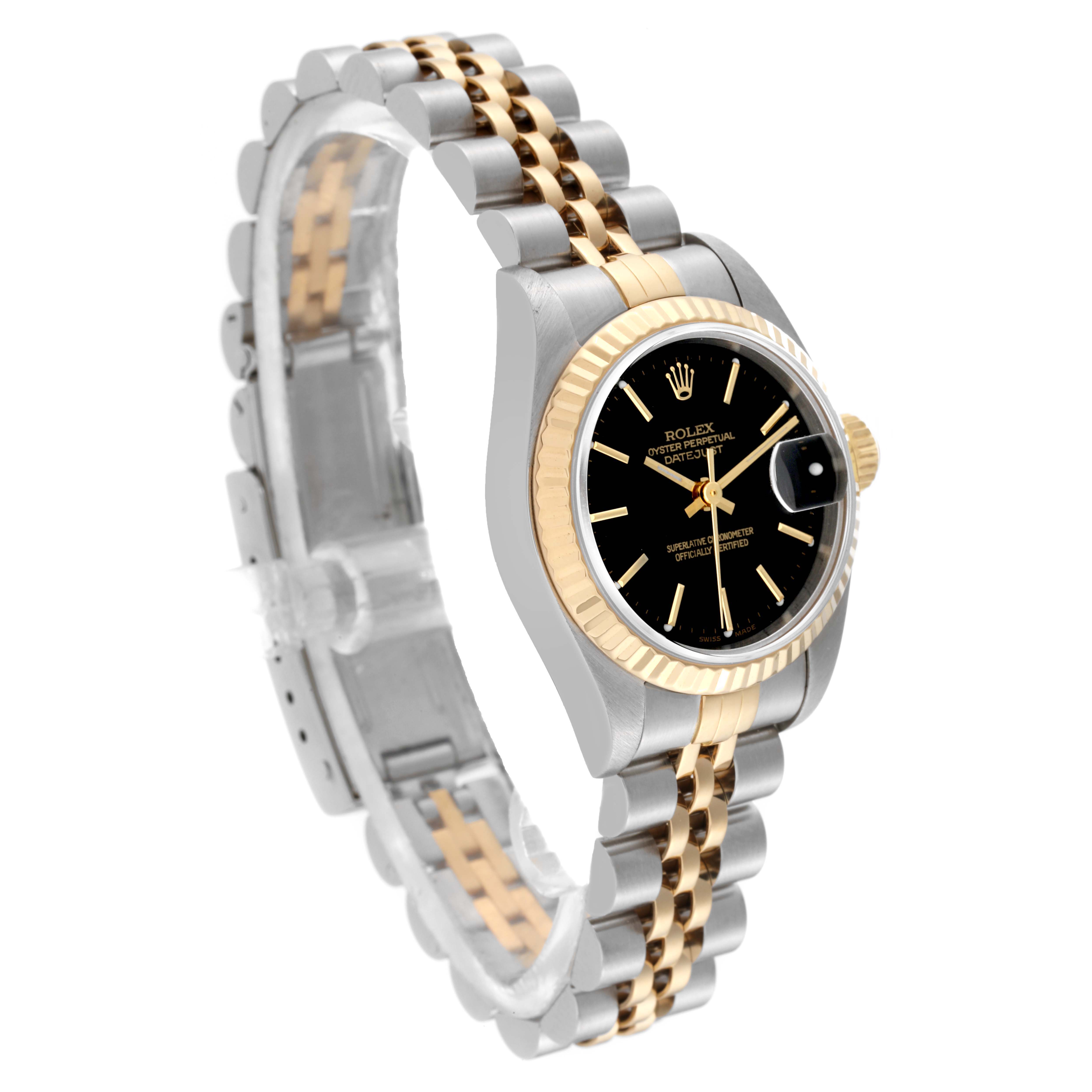 The image shows a Rolex Datejust 79173 Women's Steel and Gold (two tone) Black Dial 79173 Women's Steel and Gold (two tone) Black Dial watch angled to highlight its face, fluted bezel, and Jubilee bracelet.