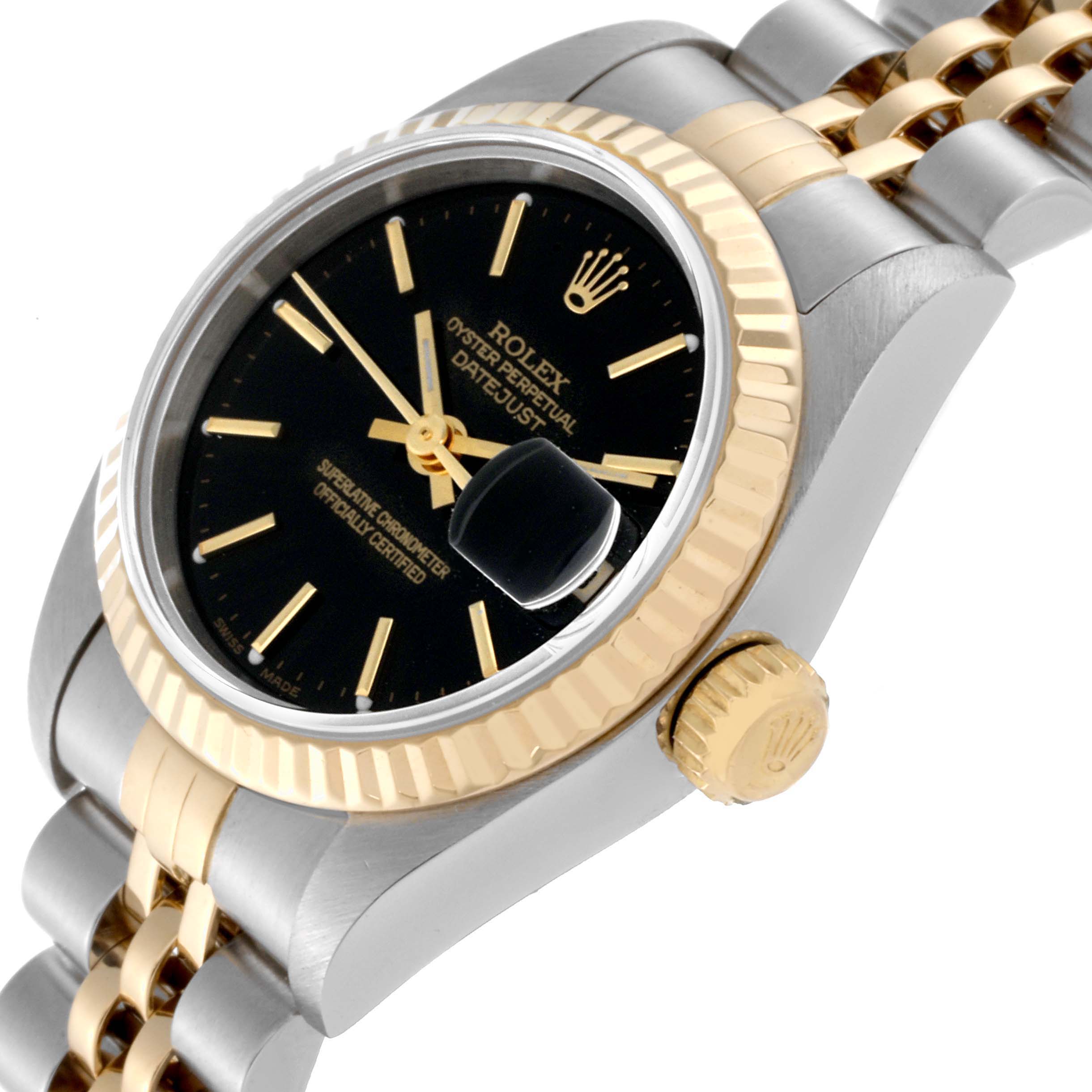 This image shows a Rolex Datejust 79173 Women's Steel and Gold (two tone) Black Dial 79173 Women's Steel and Gold (two tone) Black Dial watch at a slight angle, highlighting its dial, bezel, crown, and part of the bracelet.