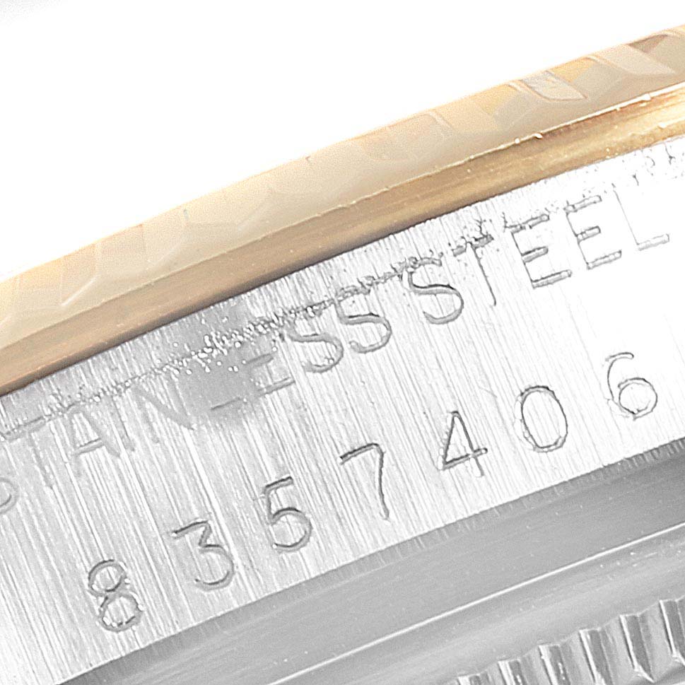 This close-up image shows the engraved stainless steel casing of the Vintage Collection watch by Rolex.