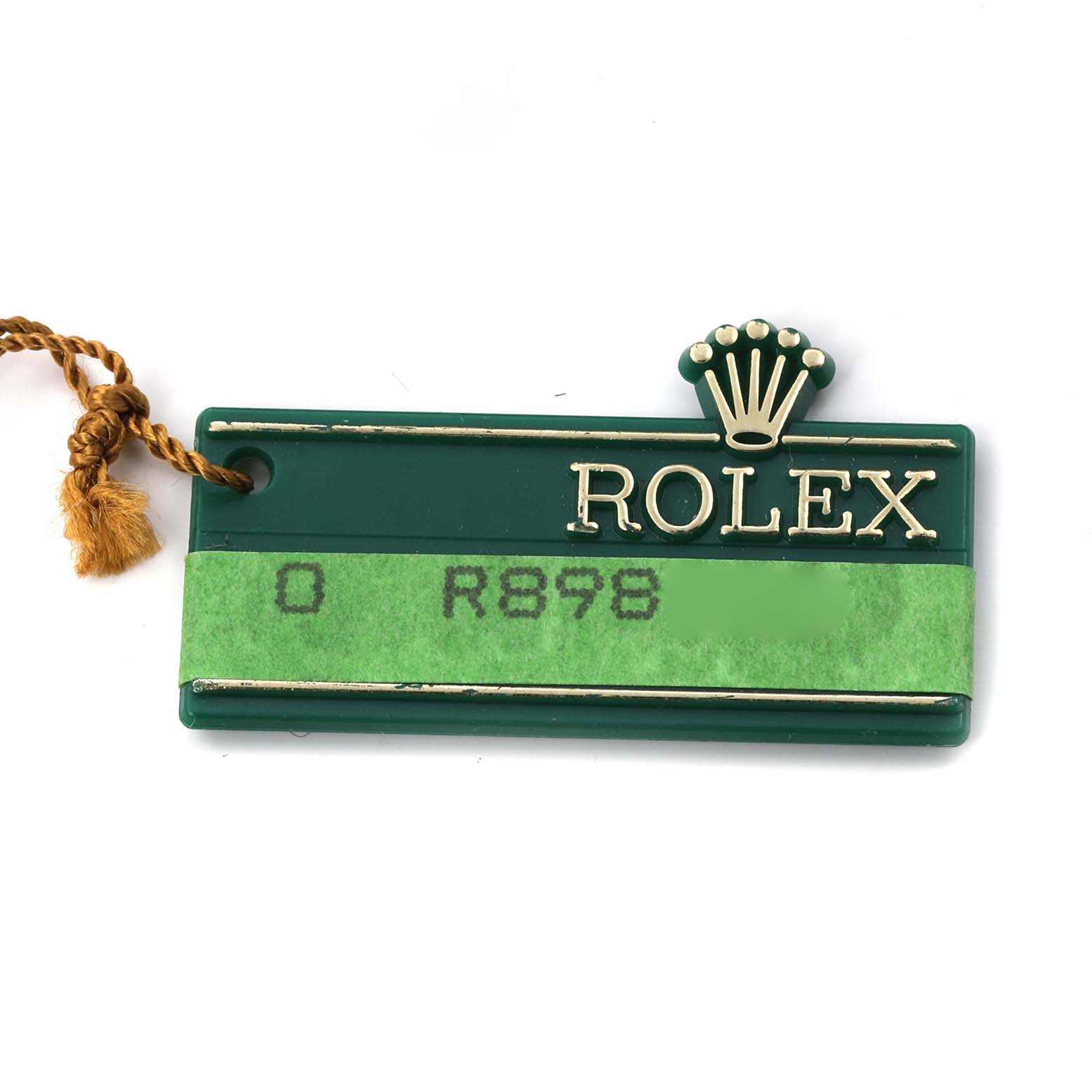 The image shows a green Rolex tag with a crown logo, associated with the Datejust model.