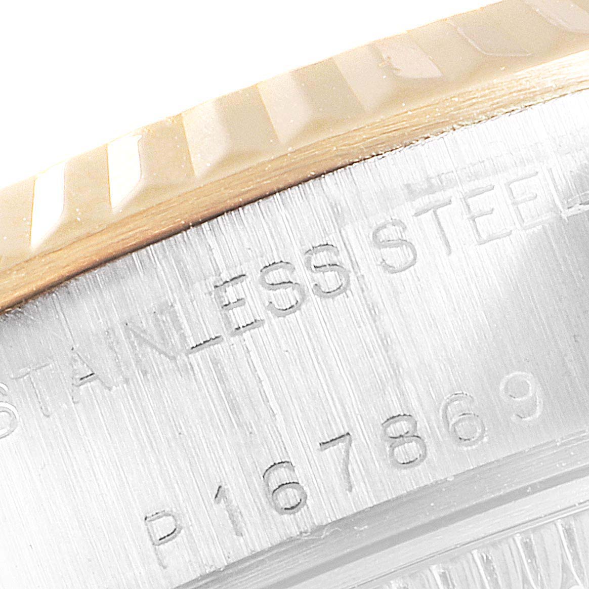 This image shows a close-up of the fluted bezel and engraved details on the case of a Rolex Datejust 79173 Women
s Steel and Gold (two tone) Champagne Dial 79173 Women
s Steel and Gold (two tone) Champagne Dial watch.