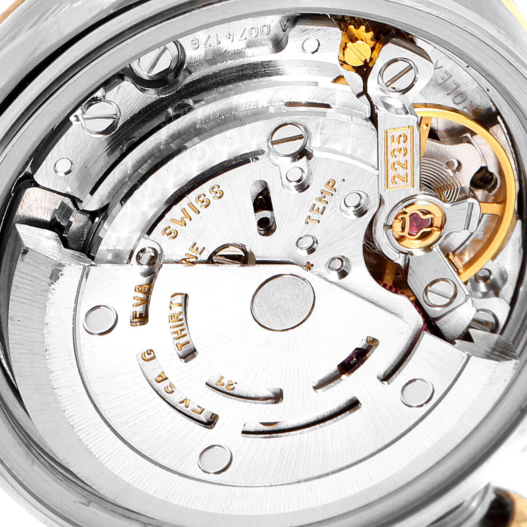 This image shows a close-up view of the movement of a Rolex Datejust 79173 Women
s Steel and Gold (two tone) Champagne Dial 79173 Women
s Steel and Gold (two tone) Champagne Dial watch, revealing the intricate internal mechanics.