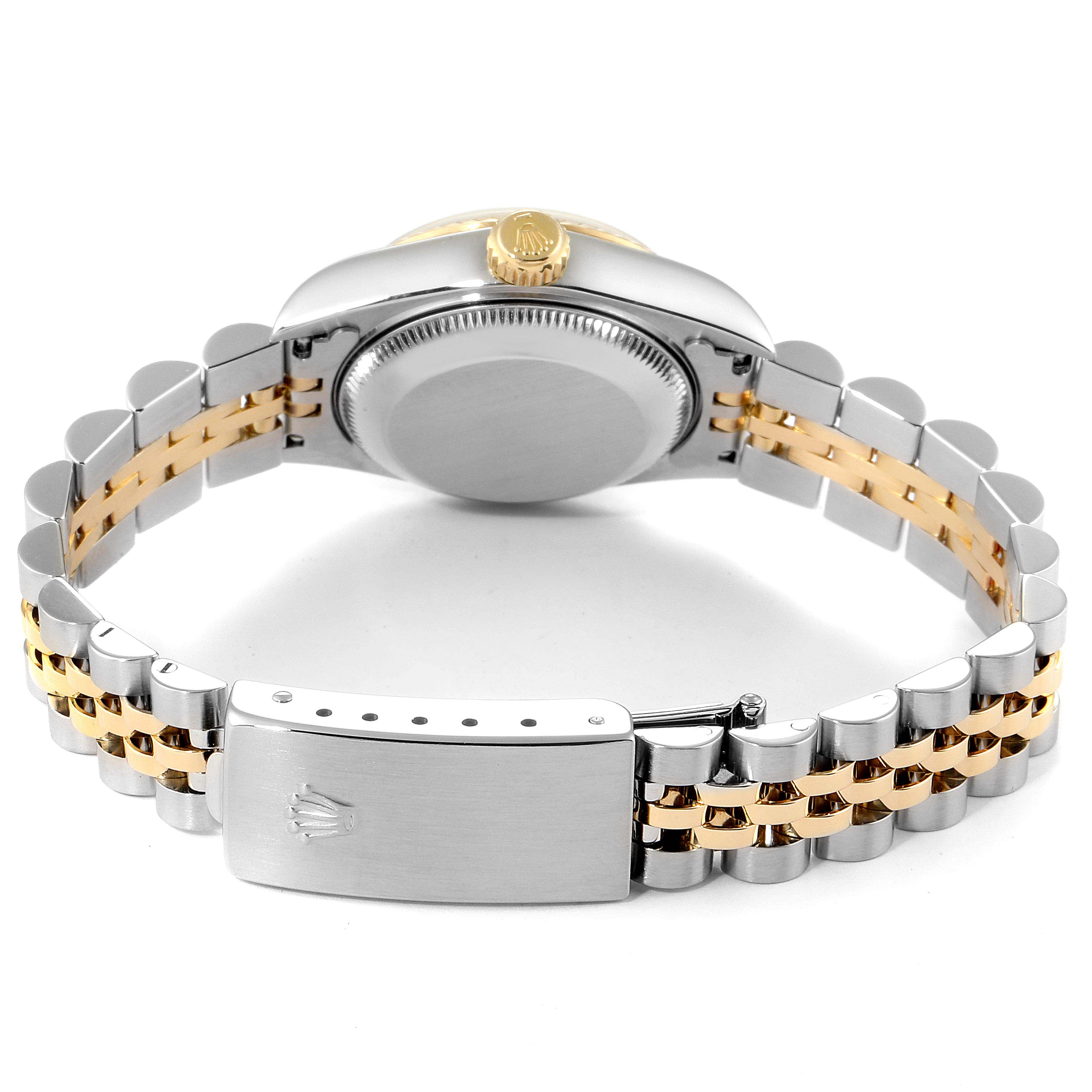 The image shows the back view of a Rolex Datejust 79173 Women
s Steel and Gold (two tone) Champagne Dial 79173 Women
s Steel and Gold (two tone) Champagne Dial watch, highlighting the case back and two-tone bracelet with clasp.