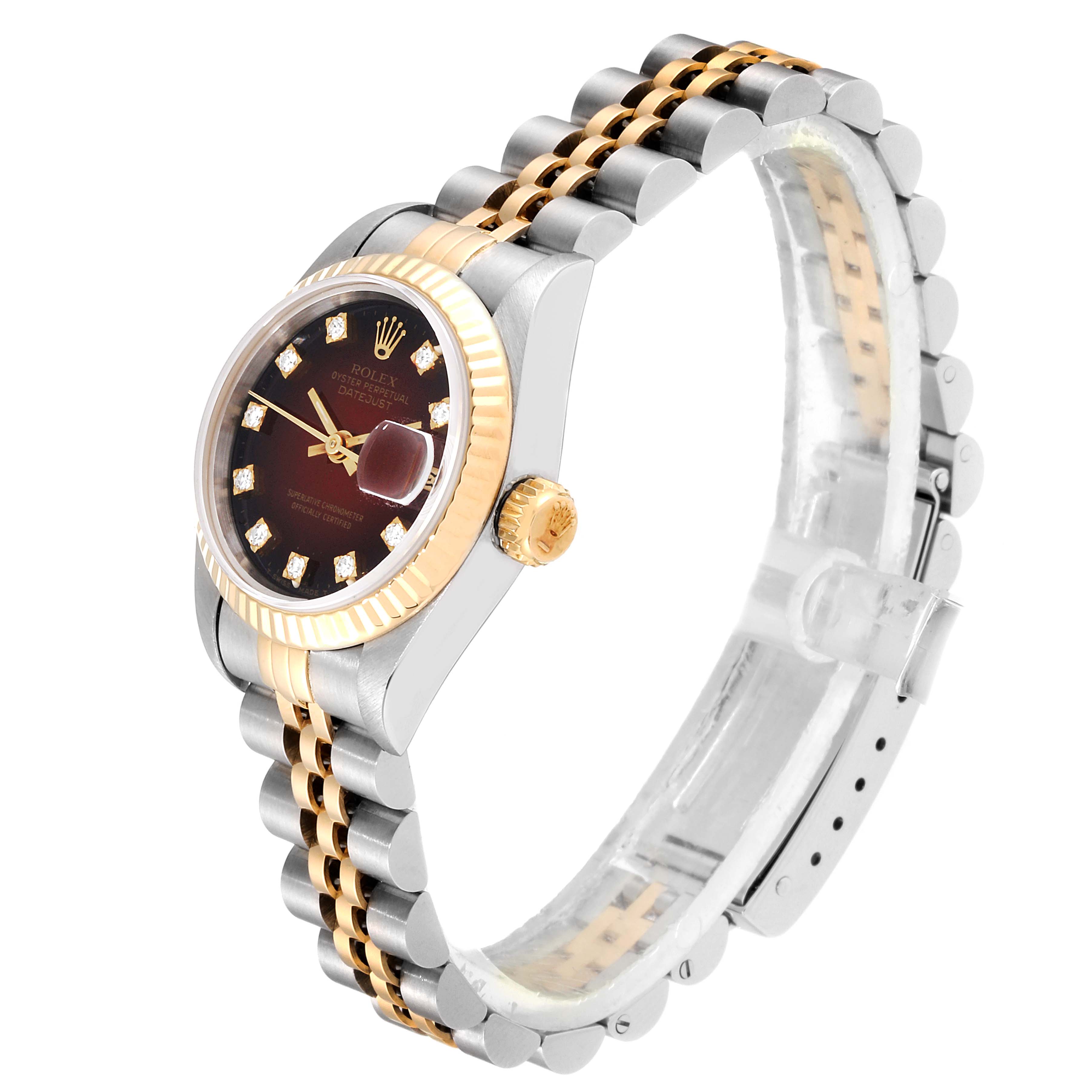 The image shows a side angle of a Rolex Datejust 69173 Women's Steel and Gold (two tone) Red Dial 69173 Women's Steel and Gold (two tone) Red Dial watch, highlighting the dial, bezel, crown, and part of the bracelet.