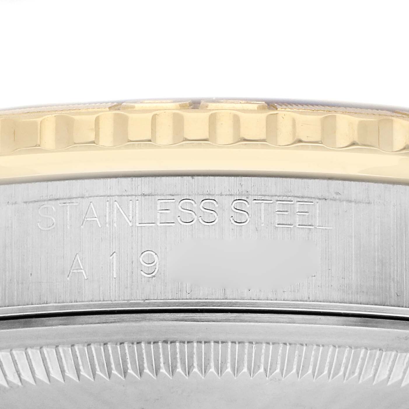 The image shows a side angle of the Rolex Turn-o-Graph 16263 Men
s Steel and Gold (two tone) Champagne Dial 16263 Men
s Steel and Gold (two tone) Champagne Dial watch with the bezel and engraved stainless steel case.