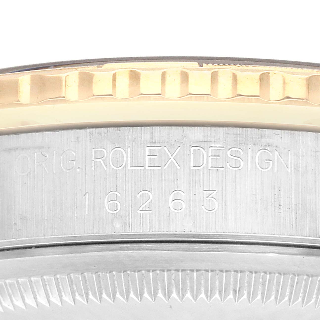 The image shows a close-up of the bezel and engraved case side of a Rolex Turn-o-Graph 16263 Men
s Steel and Gold (two tone) Champagne Dial 16263 Men
s Steel and Gold (two tone) Champagne Dial model.