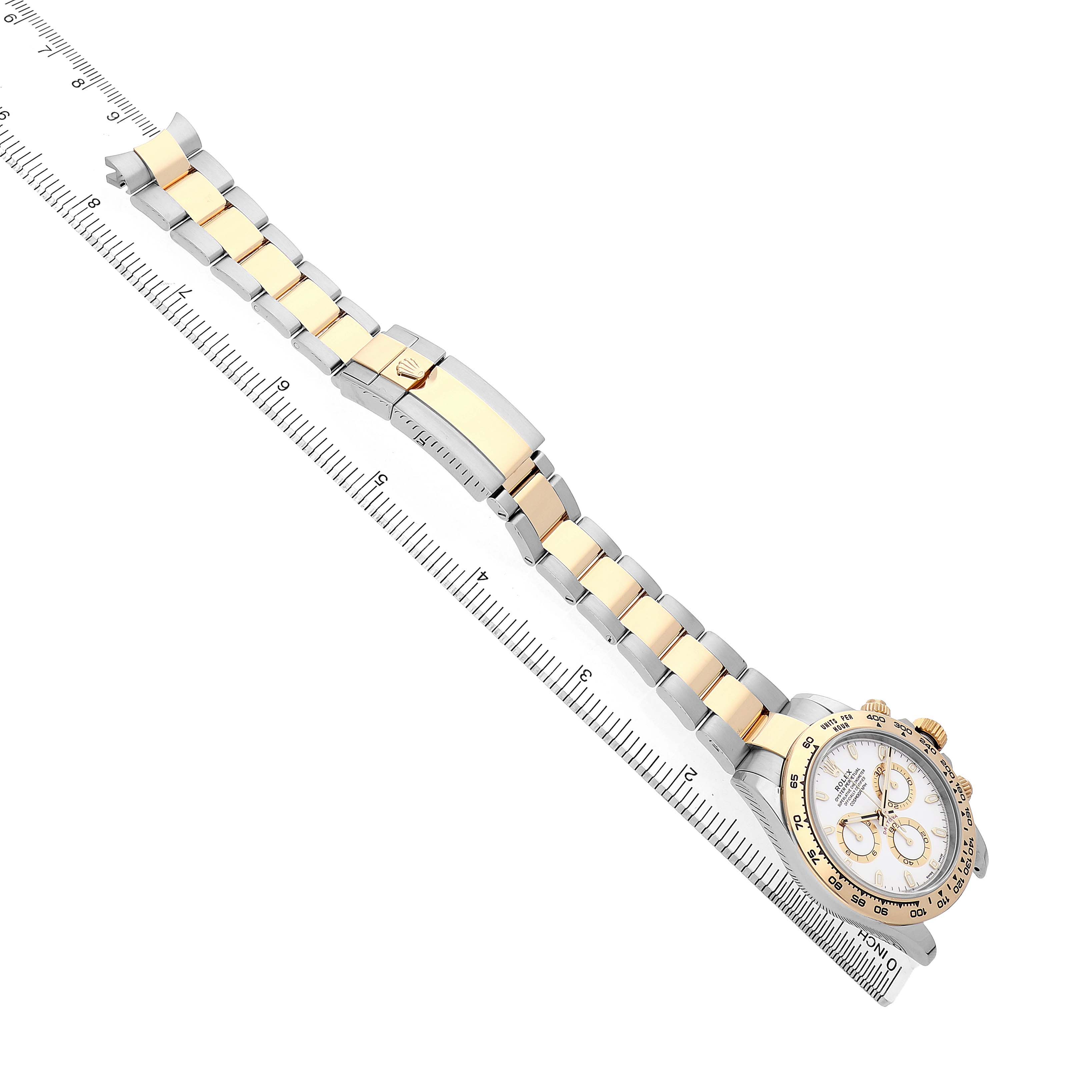 The Rolex Daytona 116503 Men's Steel and Gold (two tone) White Dial watch is displayed at an angle showing the bracelet, clasp, and partial view of the dial and bezel.